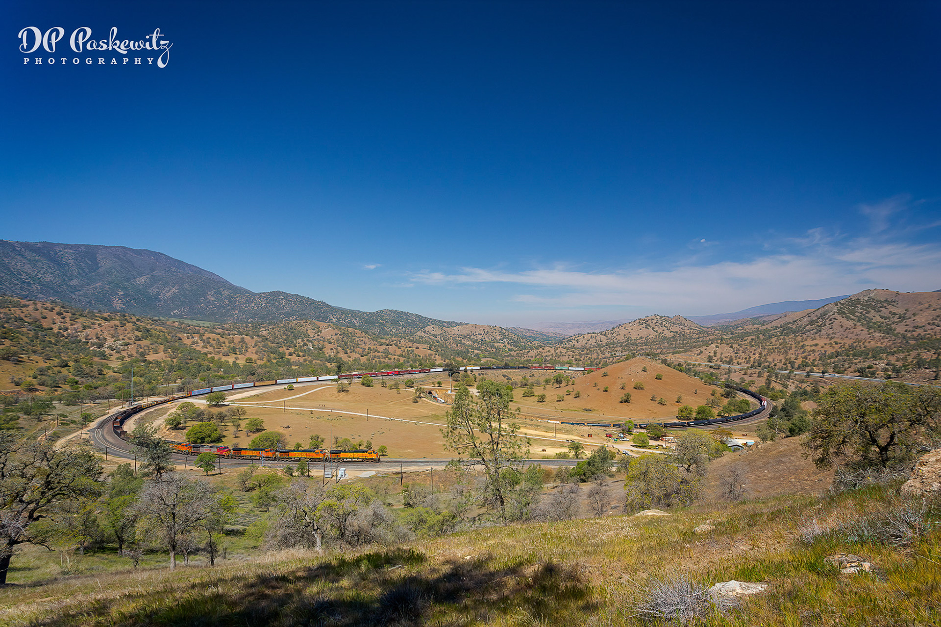 At the Loop #10: The locomotives cross the south switch for Walong siding and head for tunnel 10 at the Tehachapi Loop, Tehachapi Mountains between Tehachapi and Bakersfield, CA, 2013; Reprocessed 11/24/21
