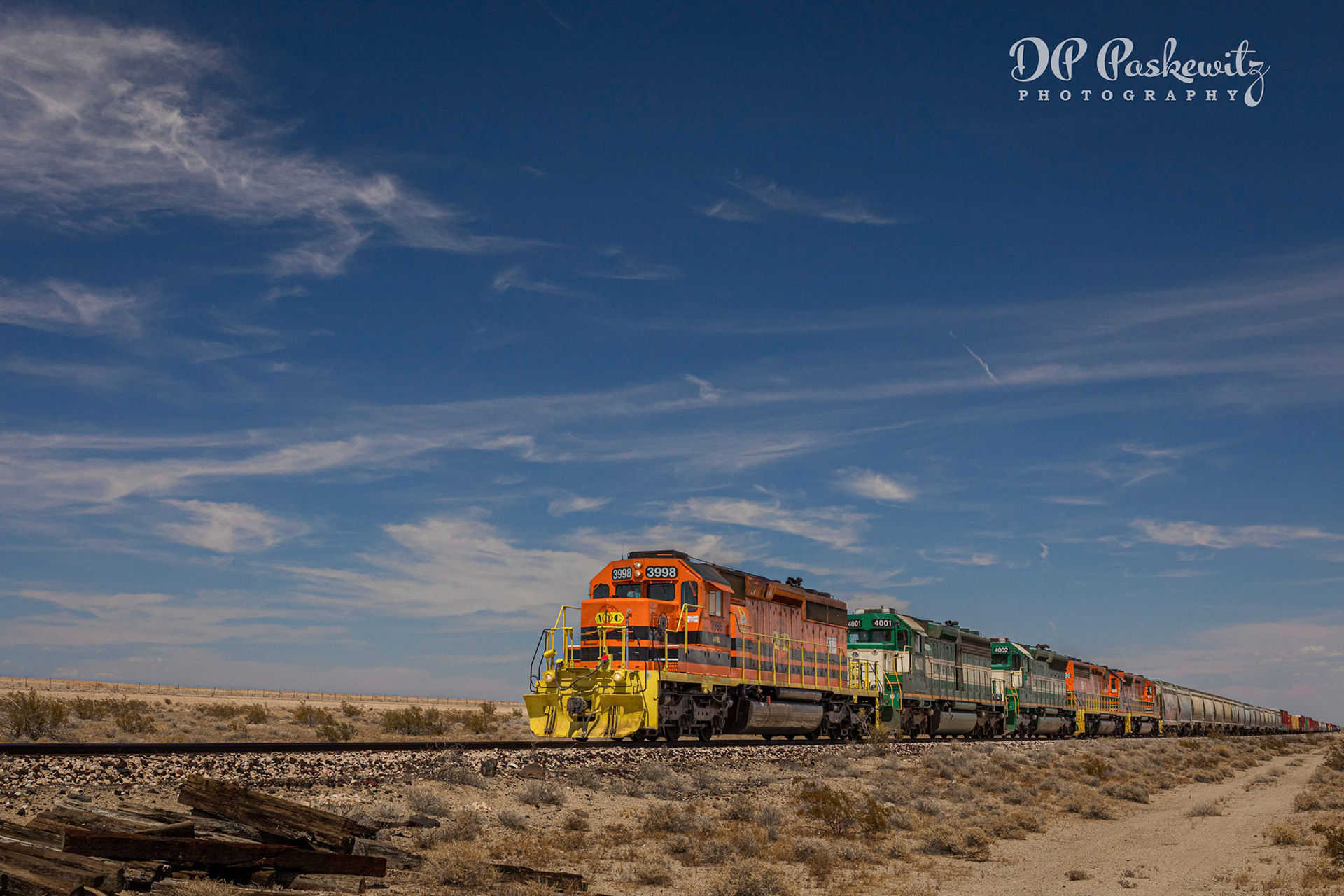 Cadiz Bound: ARZC SD40-2 3998 leads four more SD40 types (some of them rebuilt SD45s or SD45-2s) on a mixed freight train on the fomer Parker District of the ATSF. Along California Route 62 east of Rice.