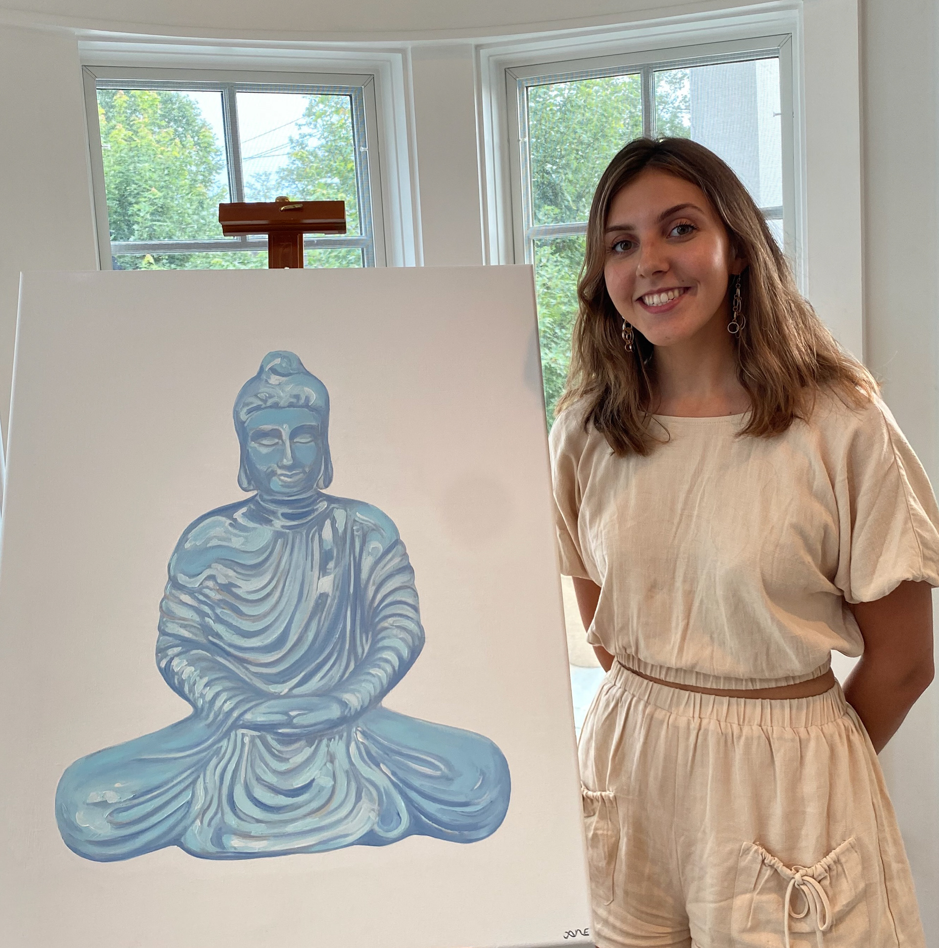 me, happy about completing my first commissioned oil painting.