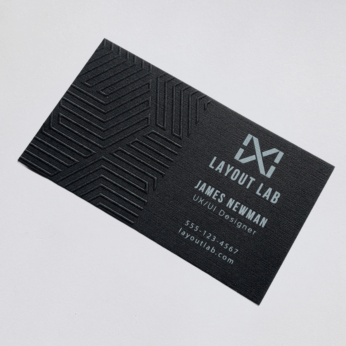 Embossed design on black stock