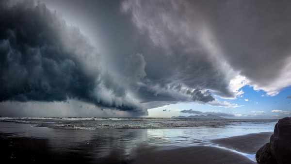 Approaching storm: A fierce southerly front swept up the coast, with Kāpiti Island still in sunshine. Moments later, the deluge caught me!