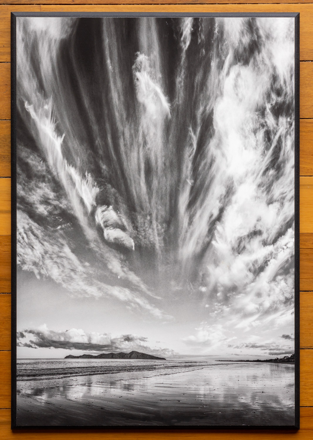 A change in the weather. Feathery cirrus clouds above the coast signal oncoming rain.