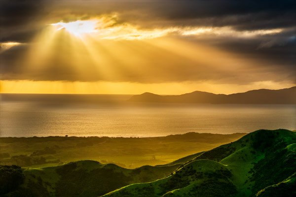 Golden beams over Kāpiti: View from the top of Mt Wainui, behind Paekākāriki.