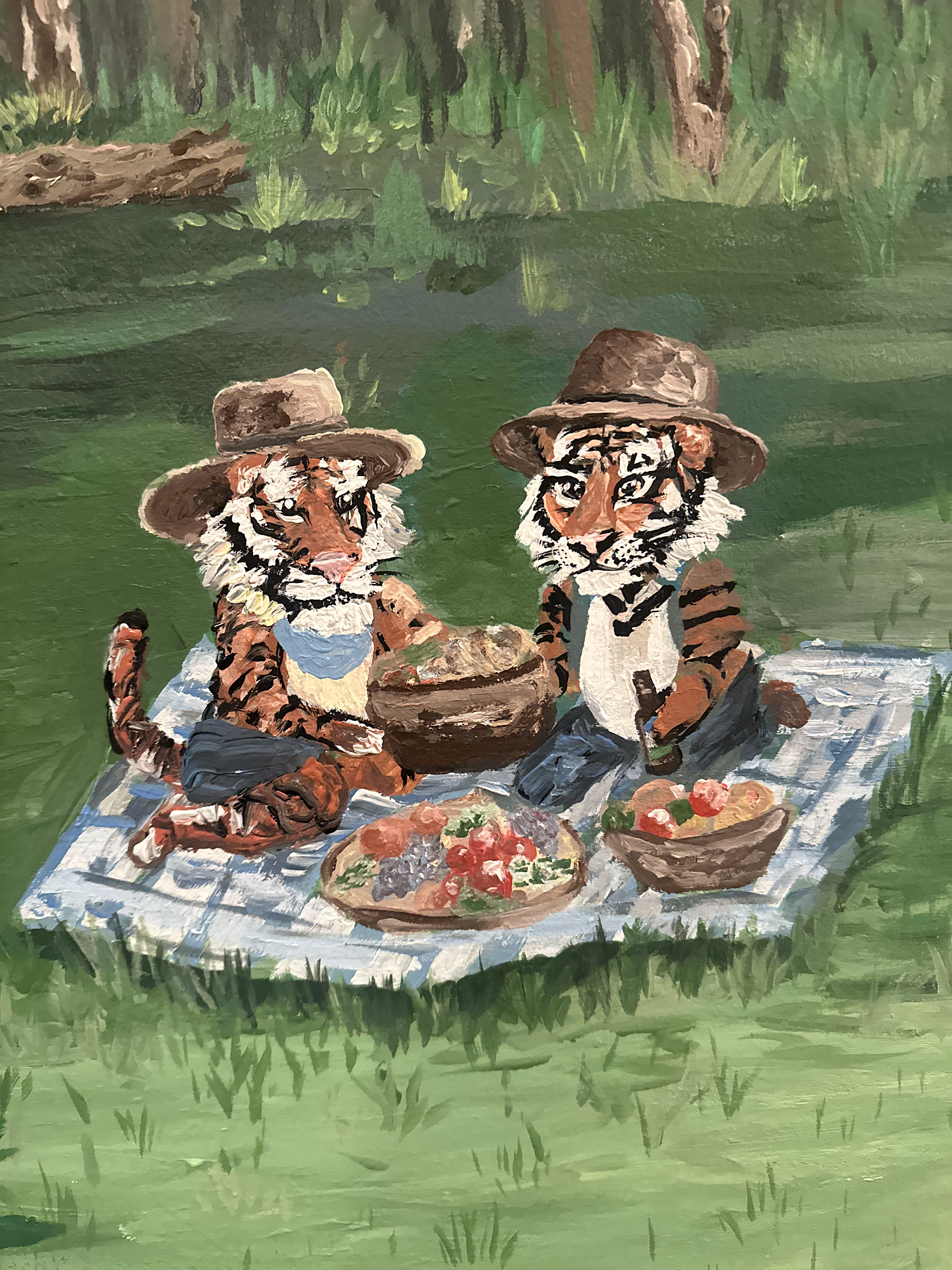 Two tiny tigers having a picnic