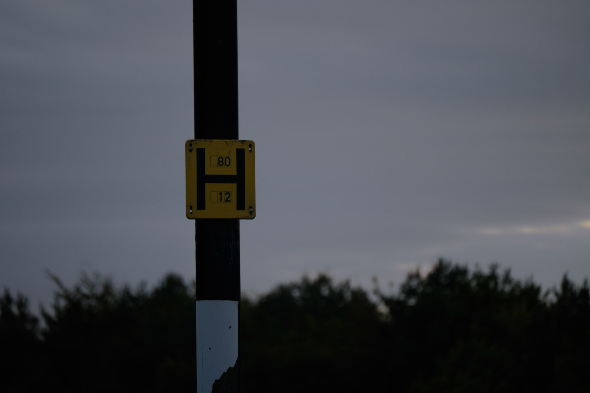 a sign on a lamp post 