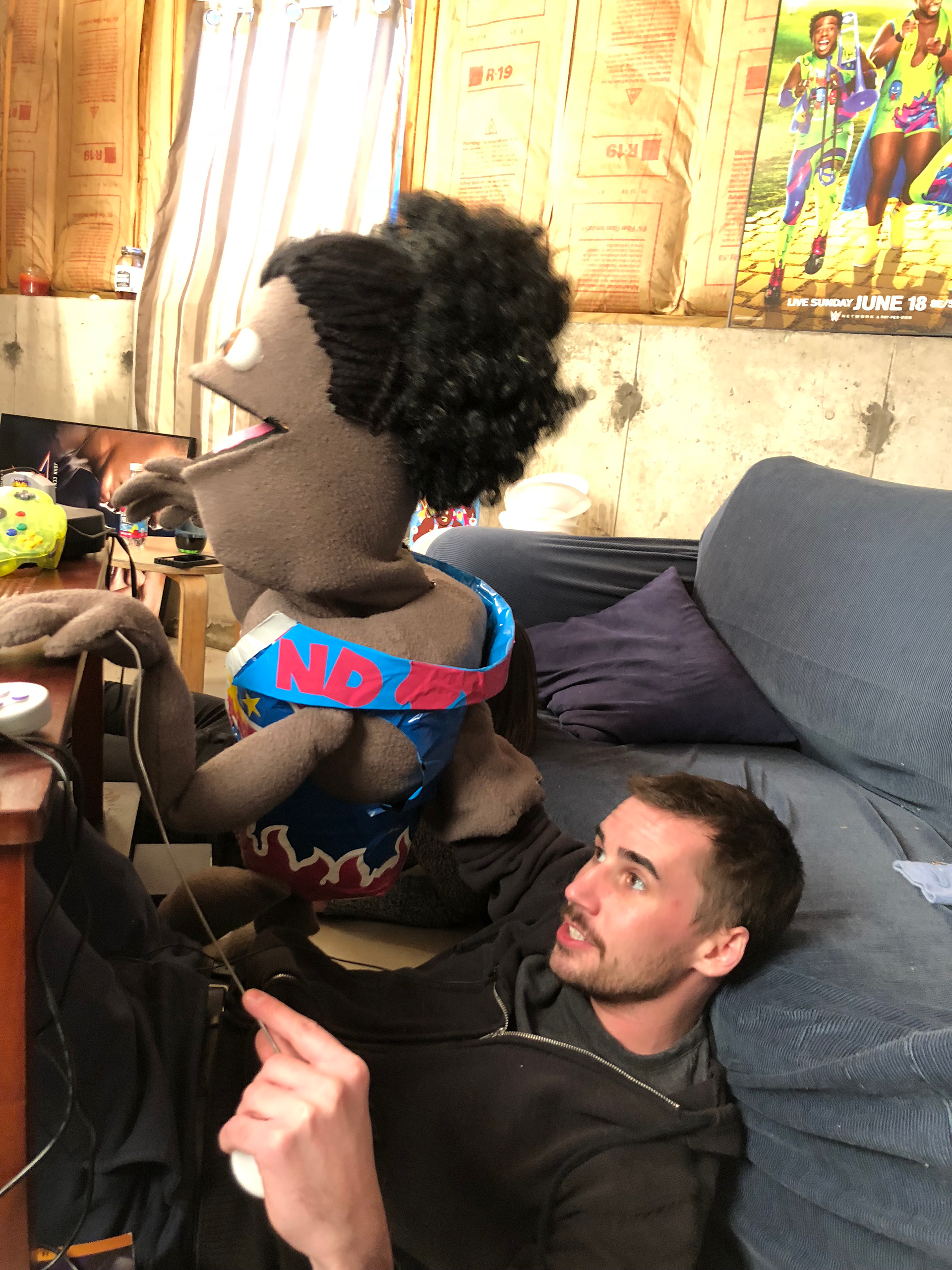 "Puppet Xavier Woods" shooting the segment "Up Up Down Down Left Right Left Right B A Start"