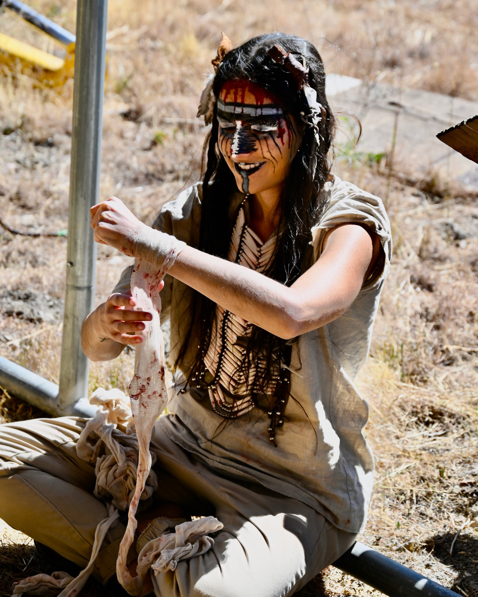 Actress Kelsey Jaffer would wrap her arms each day to cover her tattoos but also providing a very distinctive look to her character, Delicate Poison.