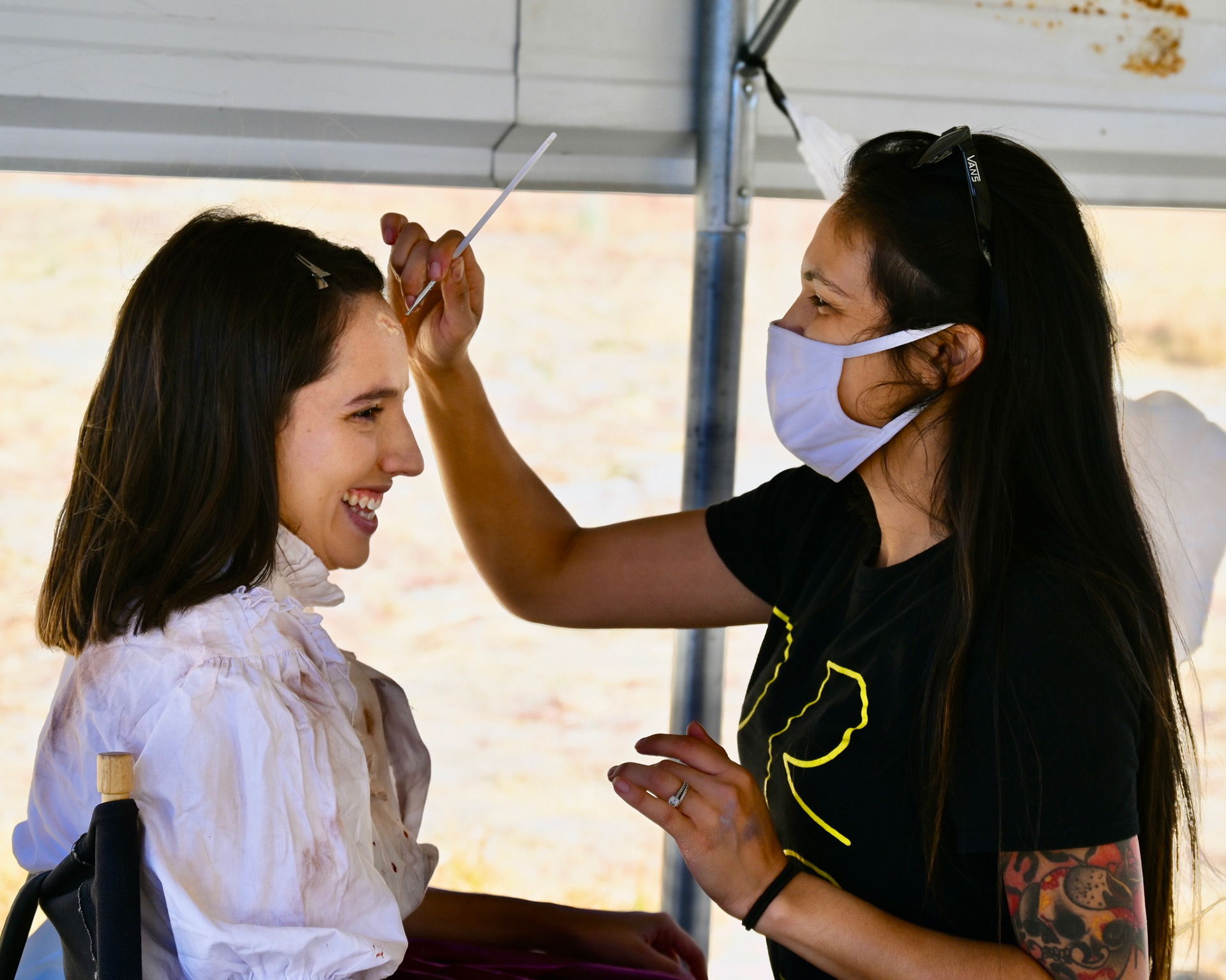 Make up artist Christine Serrano applies the scar to Paola Luelmo's forehead to get her ready as Mia in a big scene.
