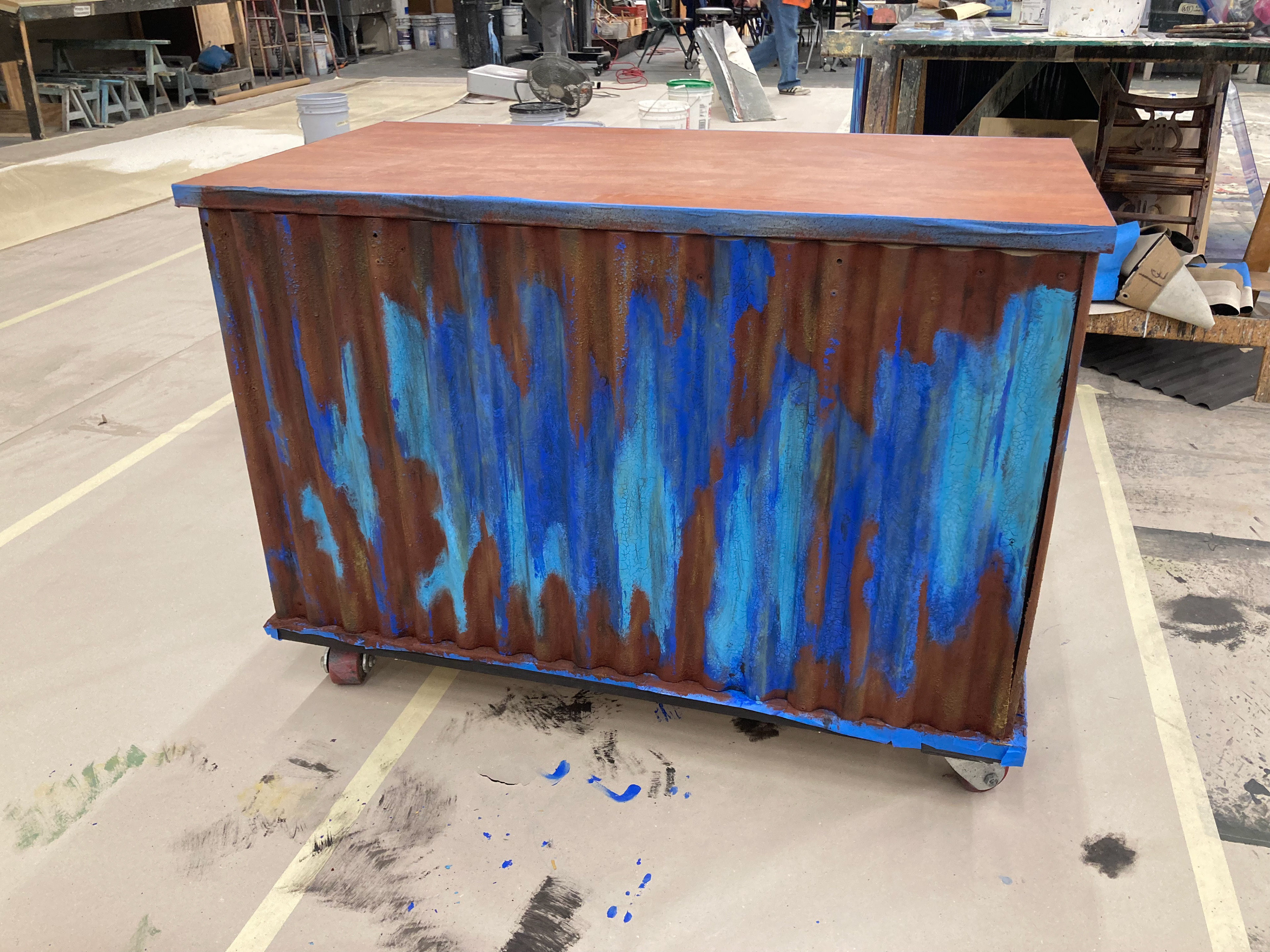 Faux rusted metal using paint, denatured alcohol, and Shellac.