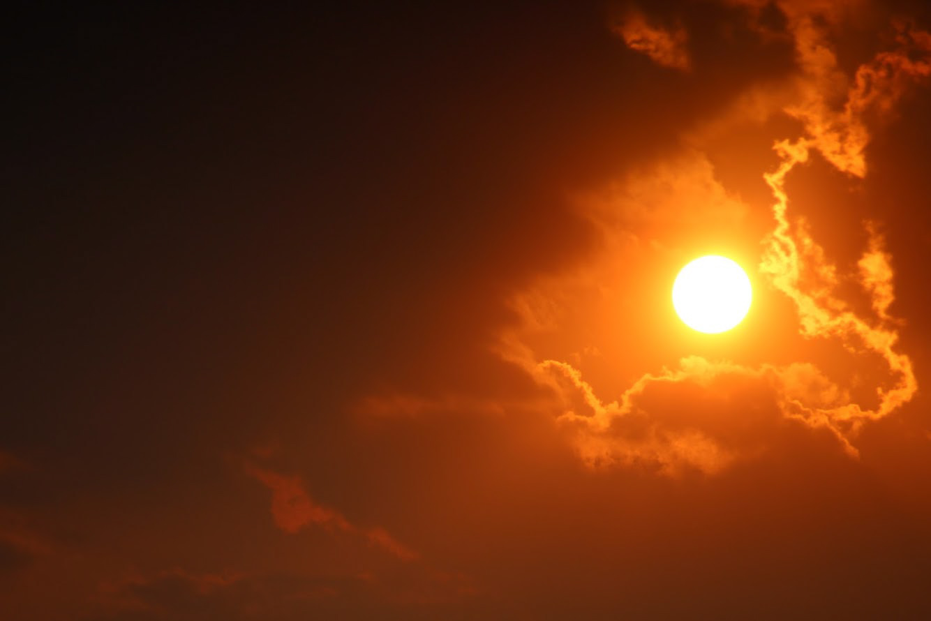 Sun Peering Through Clouds