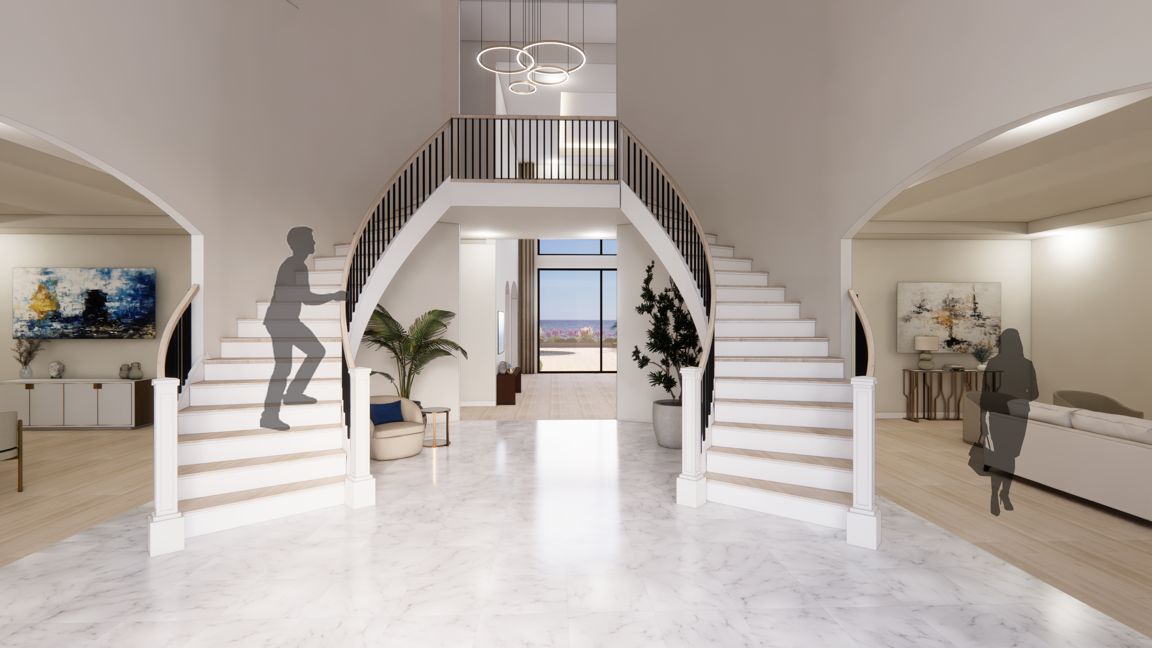 Foyer: It greets you with refined elegance,  offering a glimpse of serene lakefront beauty.  The foyer features double grand staircases  with gracefully curved walls and natural wood  steps, all under the soft glow of a magnificent  chandelier, setting the tone for the home’s  timeless charm. 