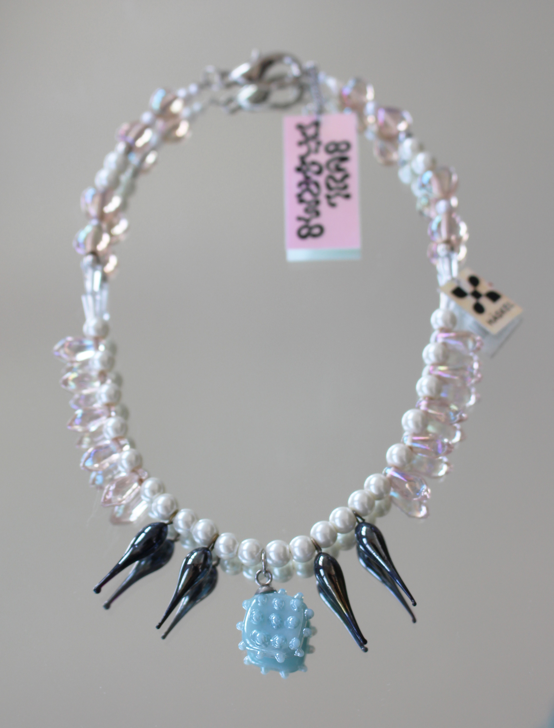 Long choker created with vintage pearls, Swarovski tears and Murano glass charm.