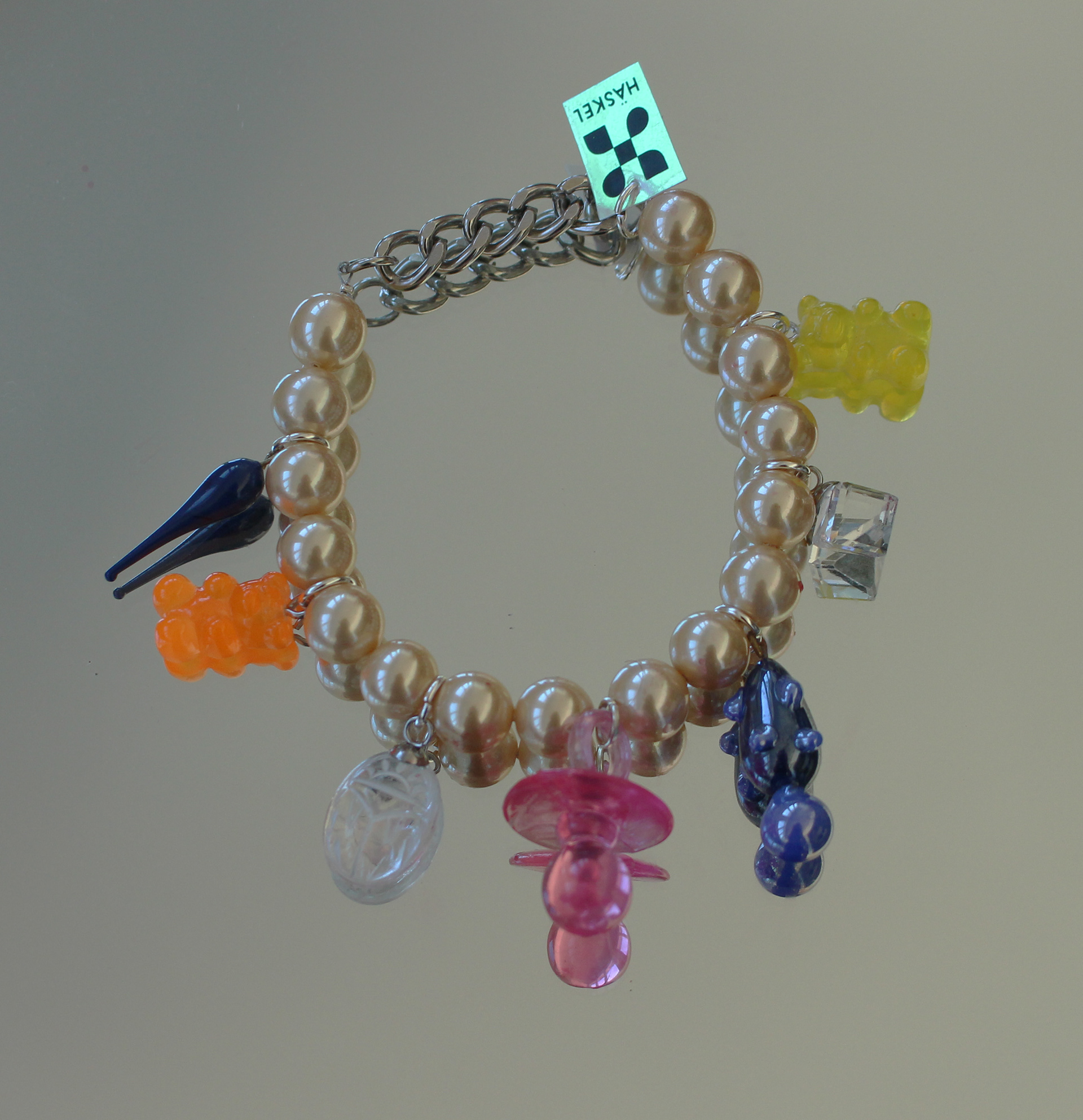 Bracelet designed with high quality vintage pearls, Swarovski and other selected charms.