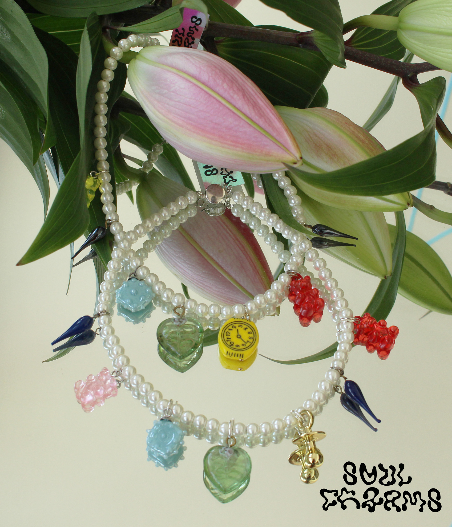 Long choker created with high quality vintage pearls, Swarovski and selected charms.