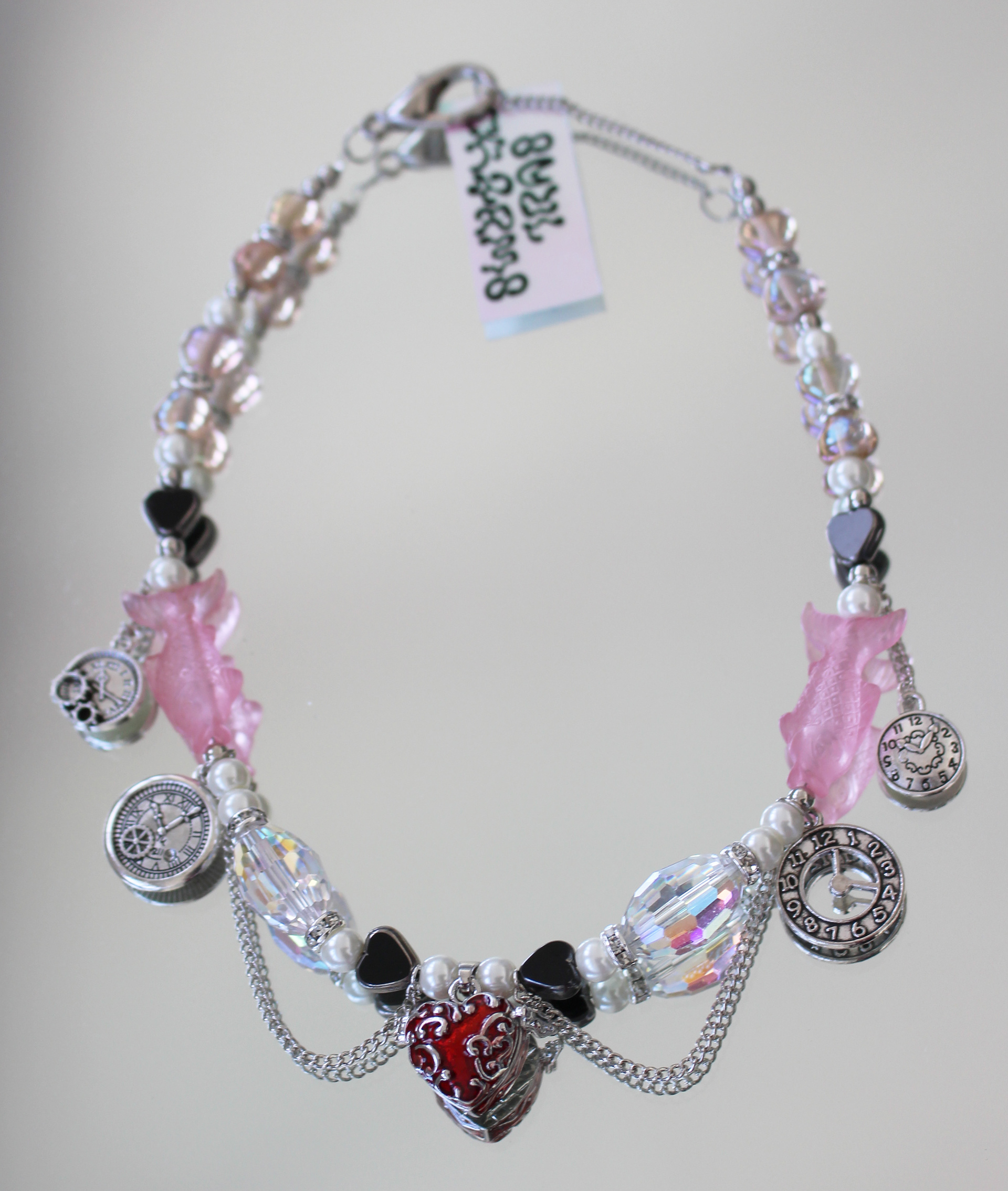 Long choker created with high quality vintage pearls, Swarovski pearls and heart locket charm..