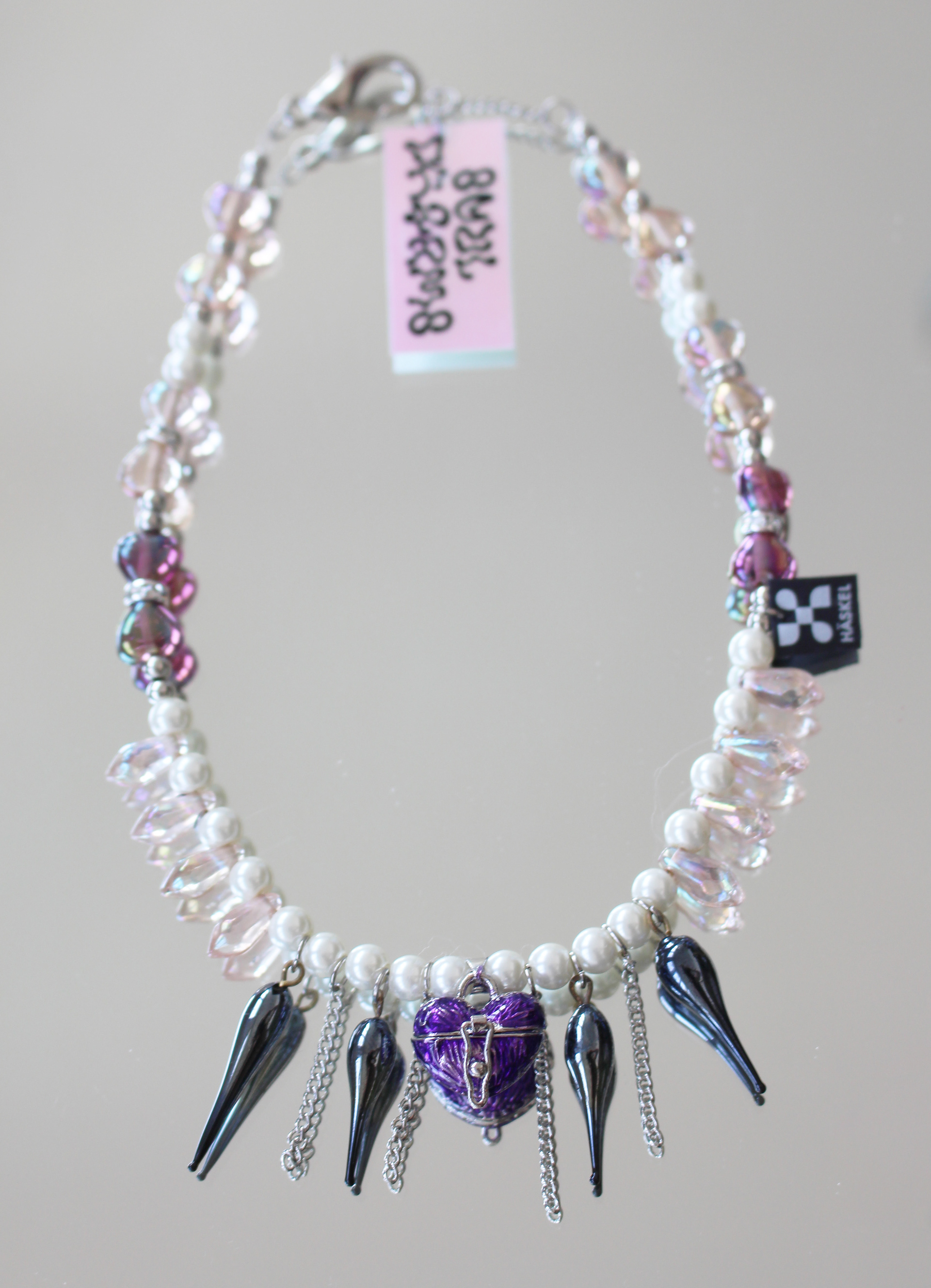 Long choker created with glass tears, Swarovski pearls and Murano glass. Heart locket rest.