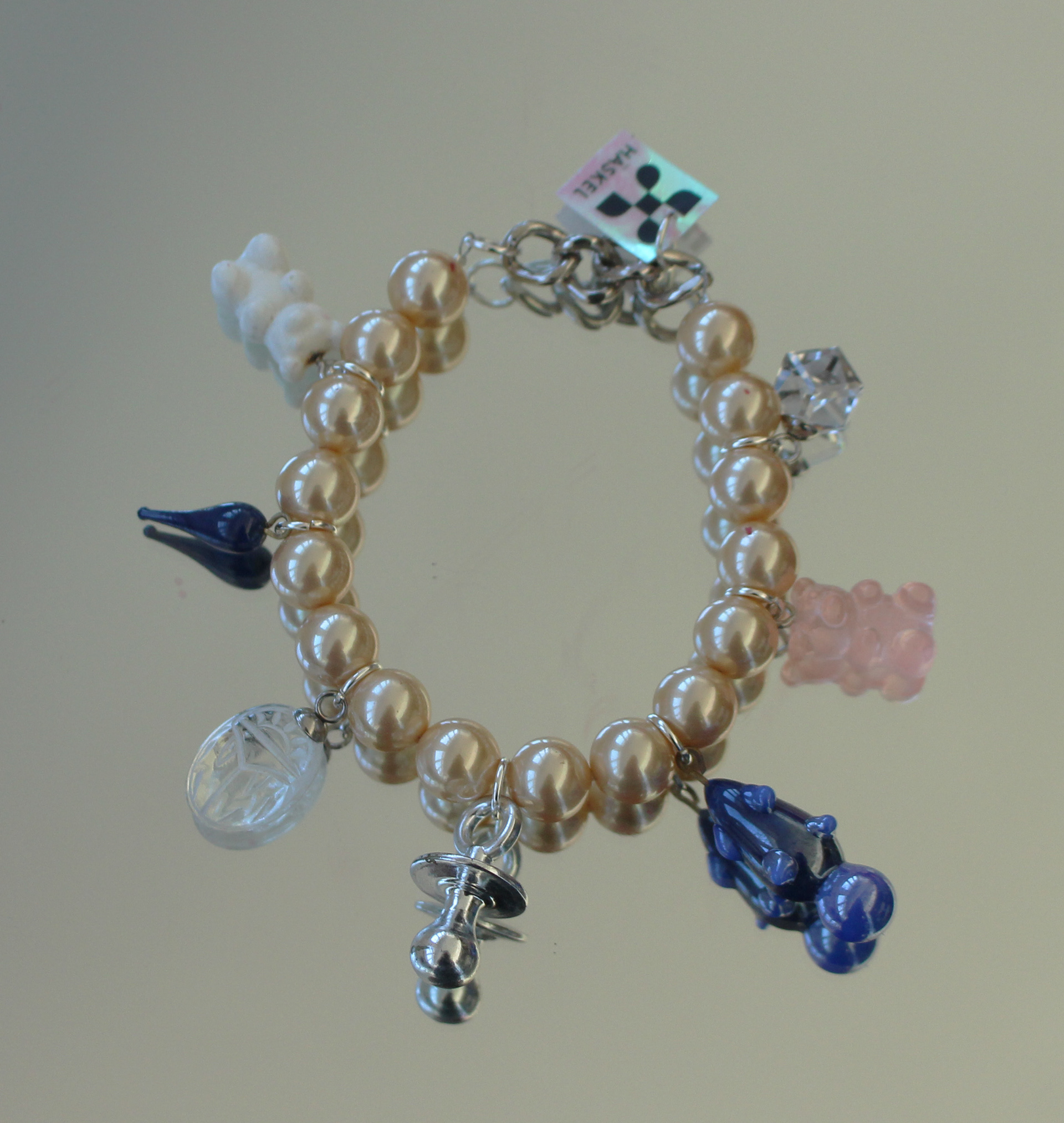 Bracelet designed with high quality vintage pearls, Swarovski and other selected charms.