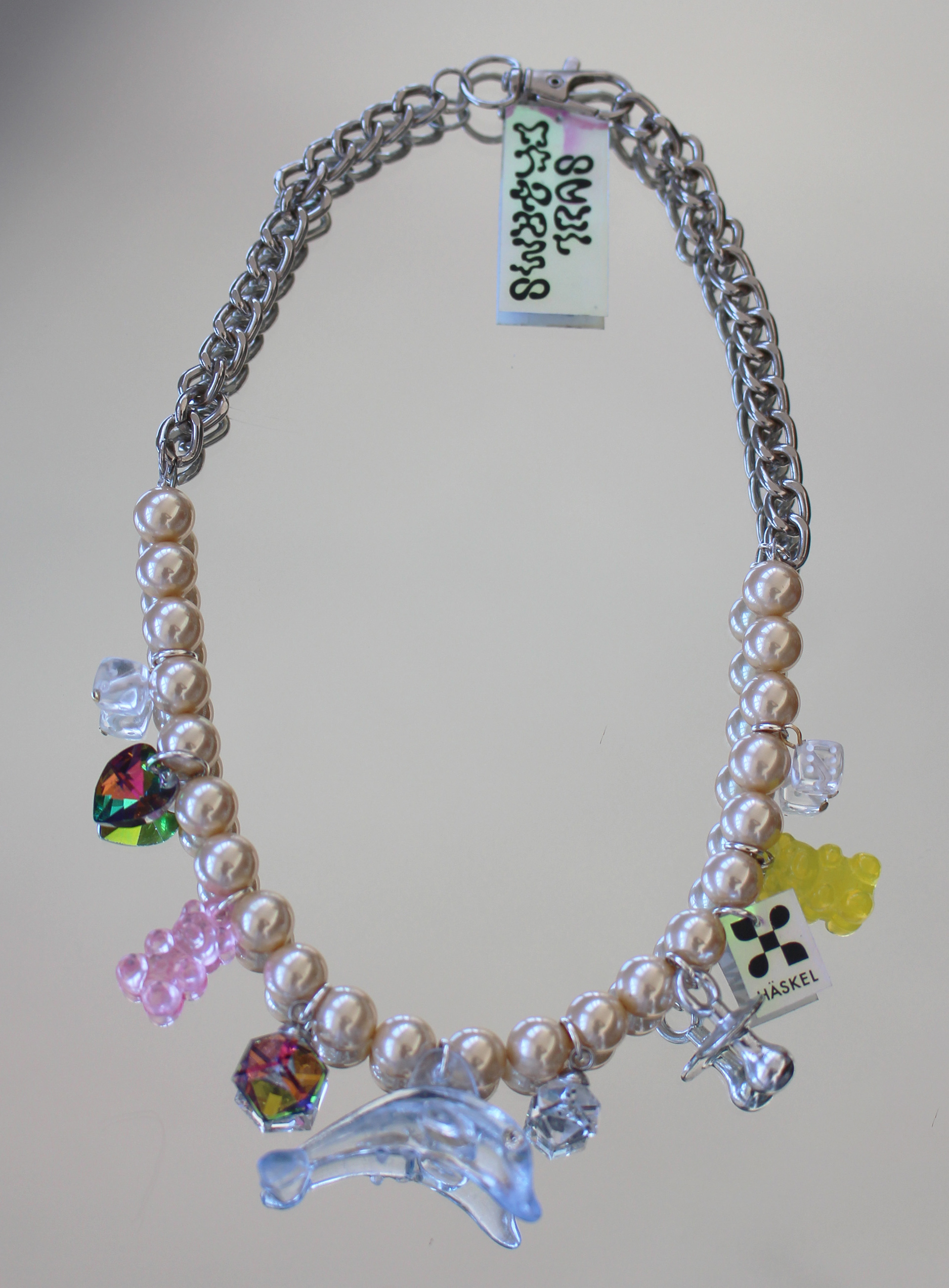 Bracelet designed with high quality vintage pearls, Swarovski and other selected charms.