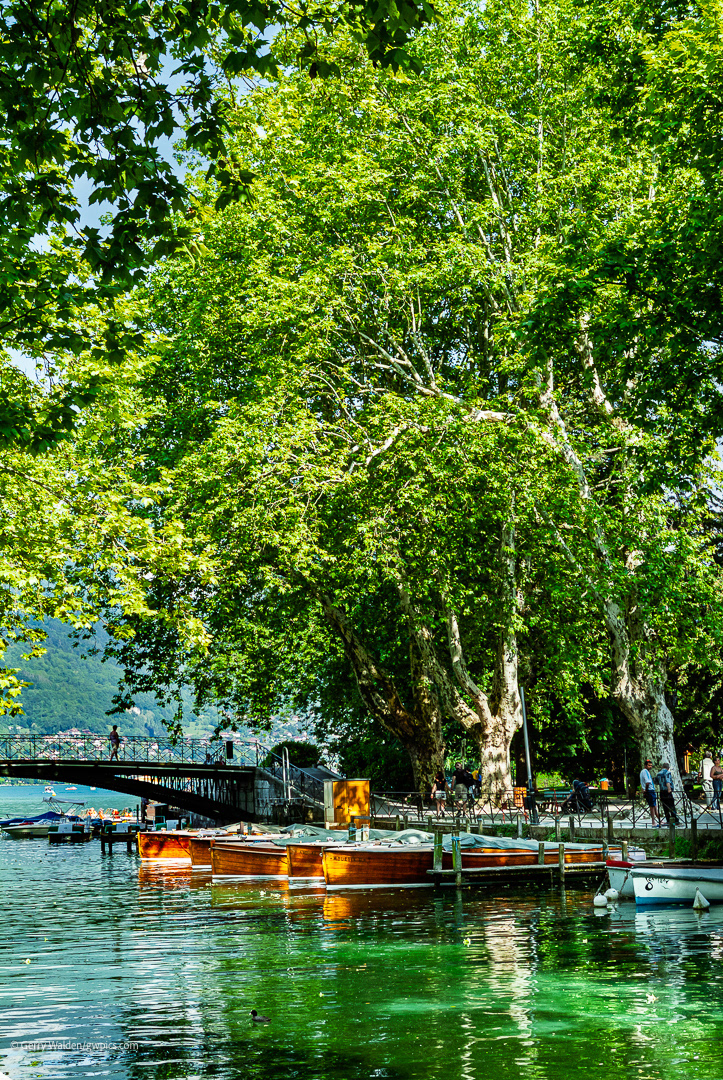 Boats on the Canal du Vasse with the Pont des Amours in the background at Annecy, Haute Savoie, France