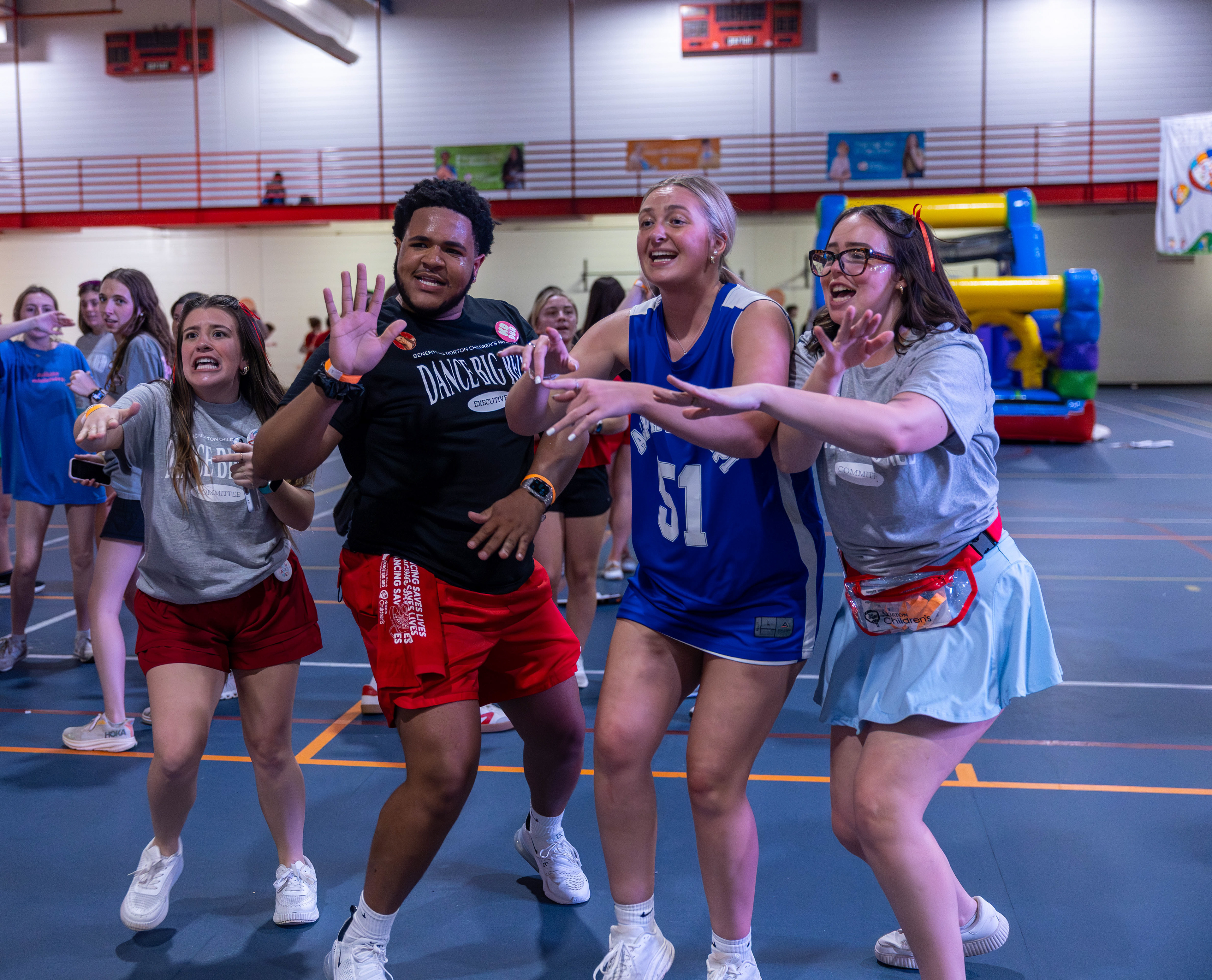 From left, Hailey Hubbs, Demani Bell, Mazi Hull and Karlee Powell dance and sing at Dance Big Red 2026 on Friday, March 6, at the Preston Center.