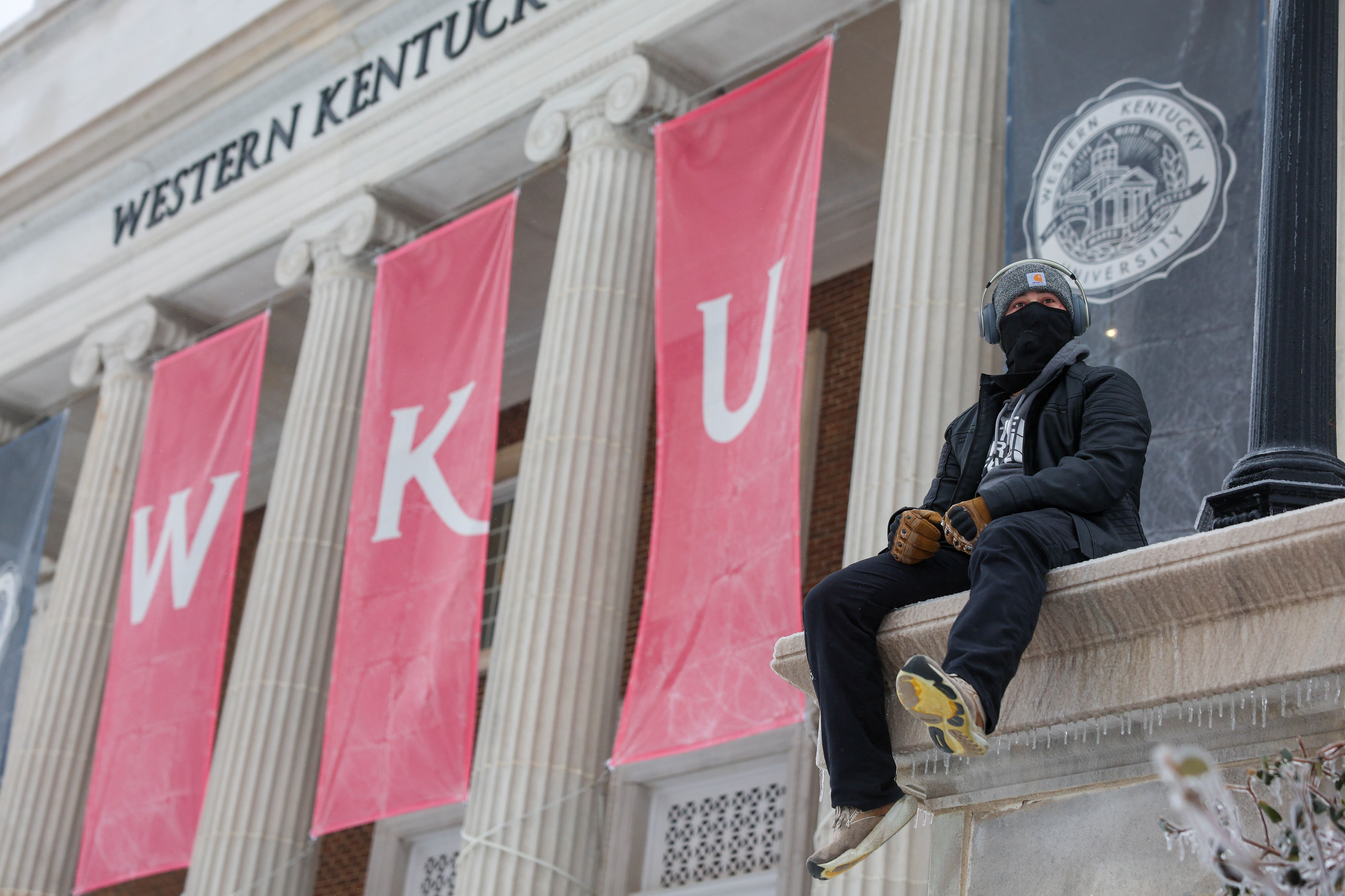 Jackie a sophmore at WKU studying Excercise science with a minor in millitary science enjoys the view of a snow coevered hill at Vanmeter Hall on January 25 2026.