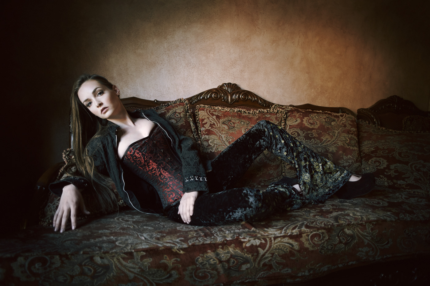 Beautiful girl on couch.  Photo by Modern Human