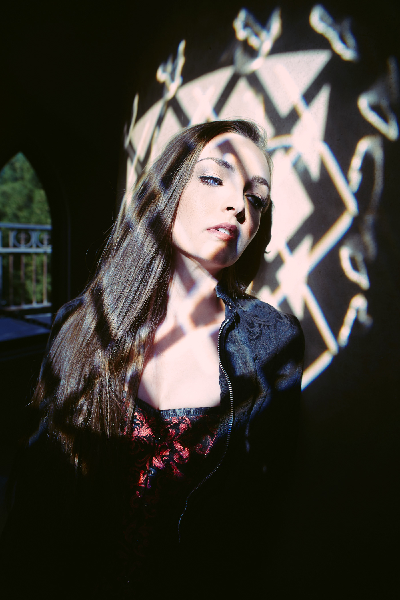 Beautiful girl painted in stained glass light.  Photo by Modern Human