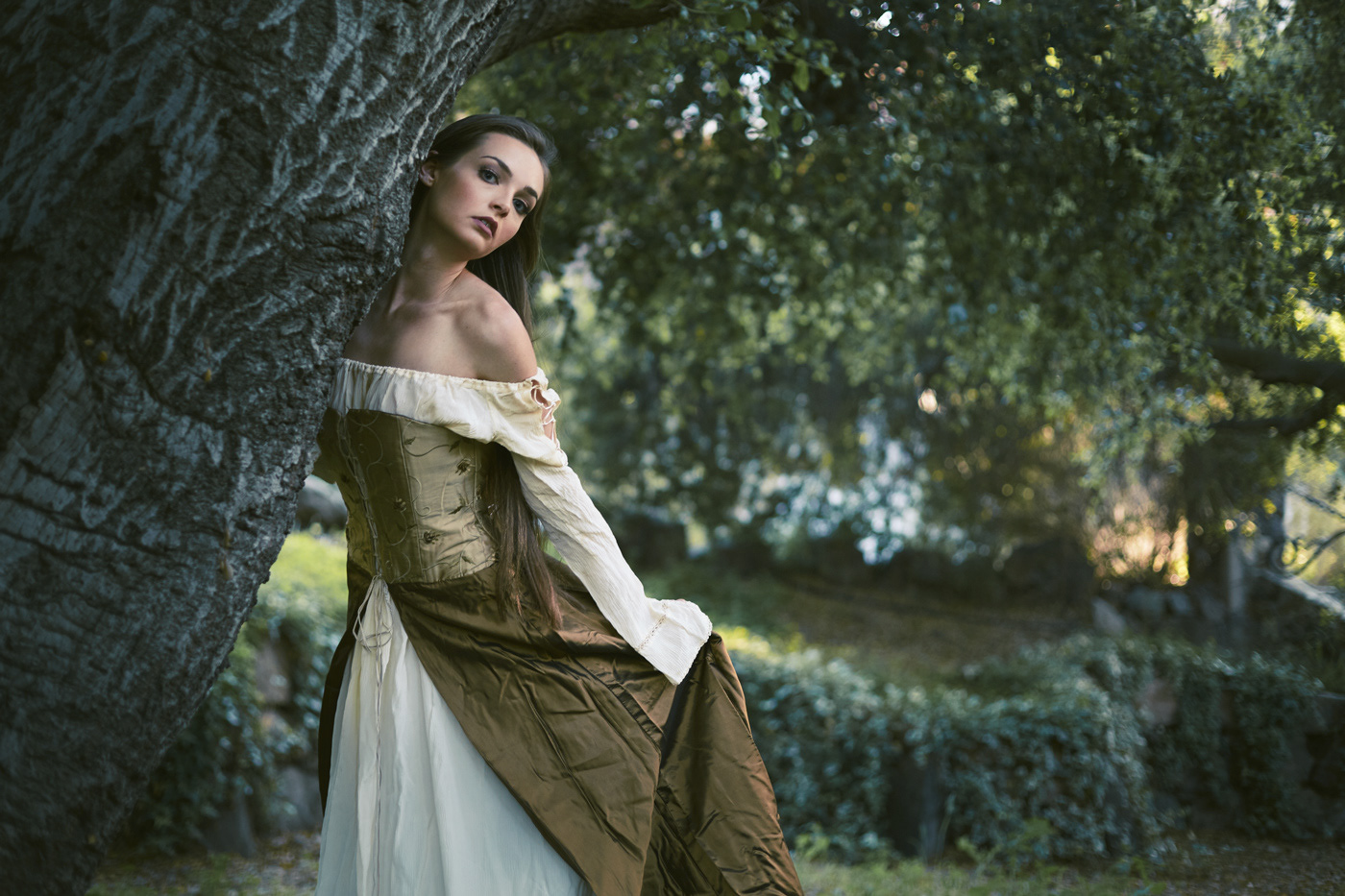 Beautiful girl embracing a tree.  Photo by Modern Human