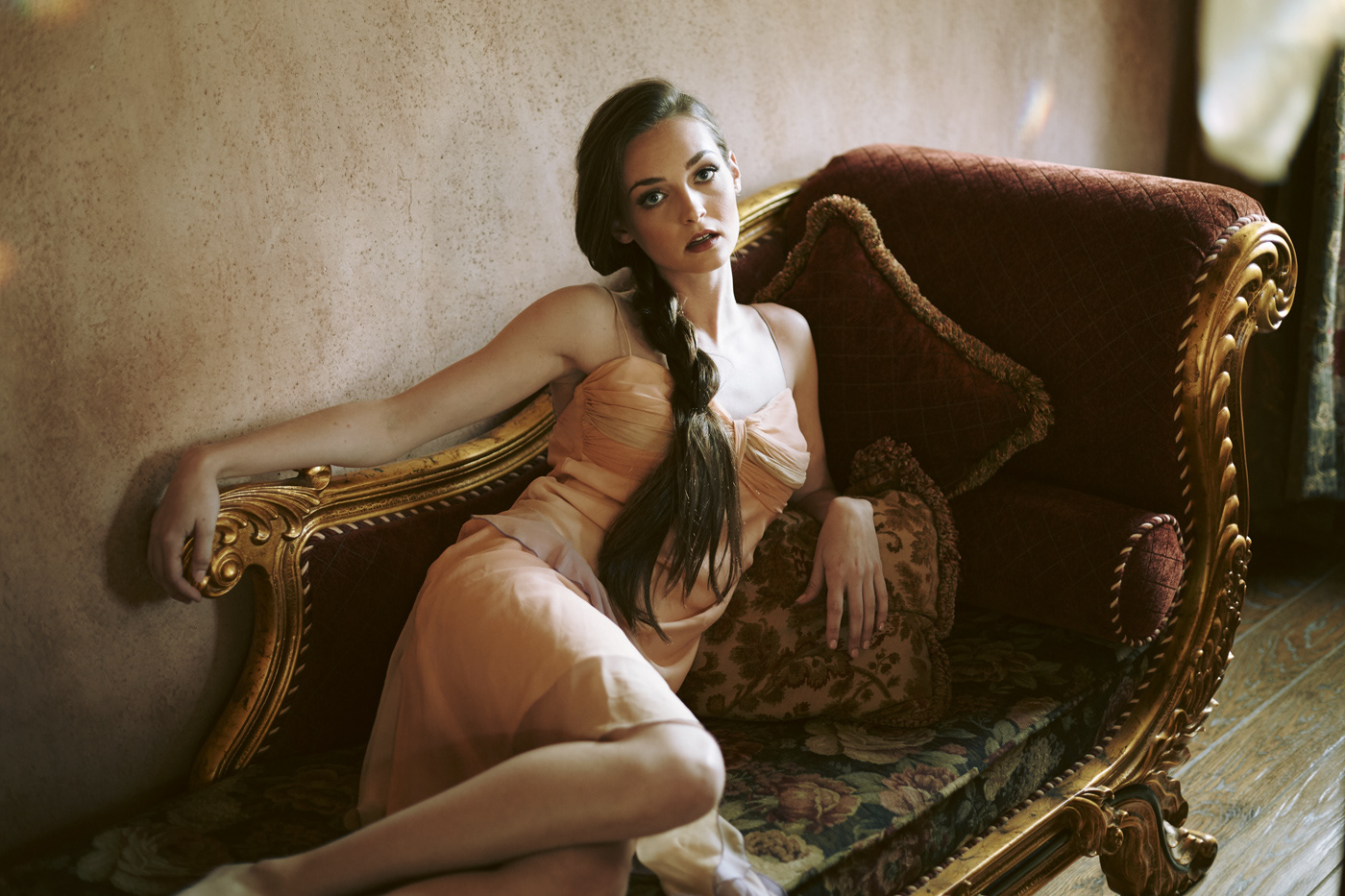 Beautiful girl on lounge.  Photo by Modern Human