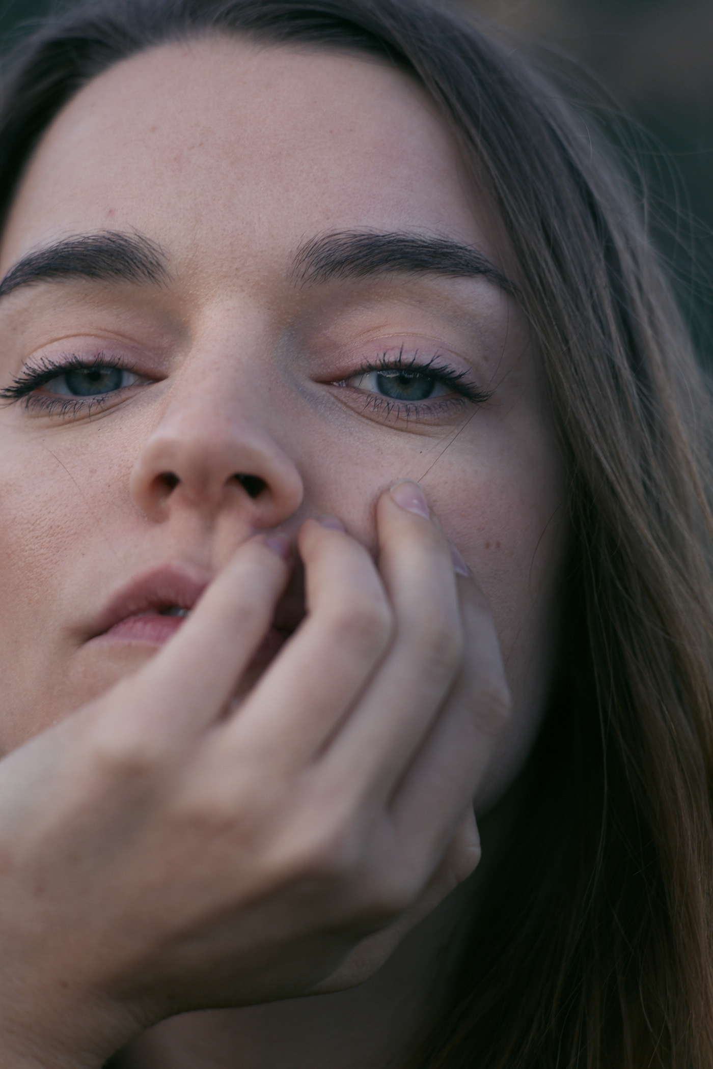 Beautiful woman clutching face portrait. Photo by Modern Human