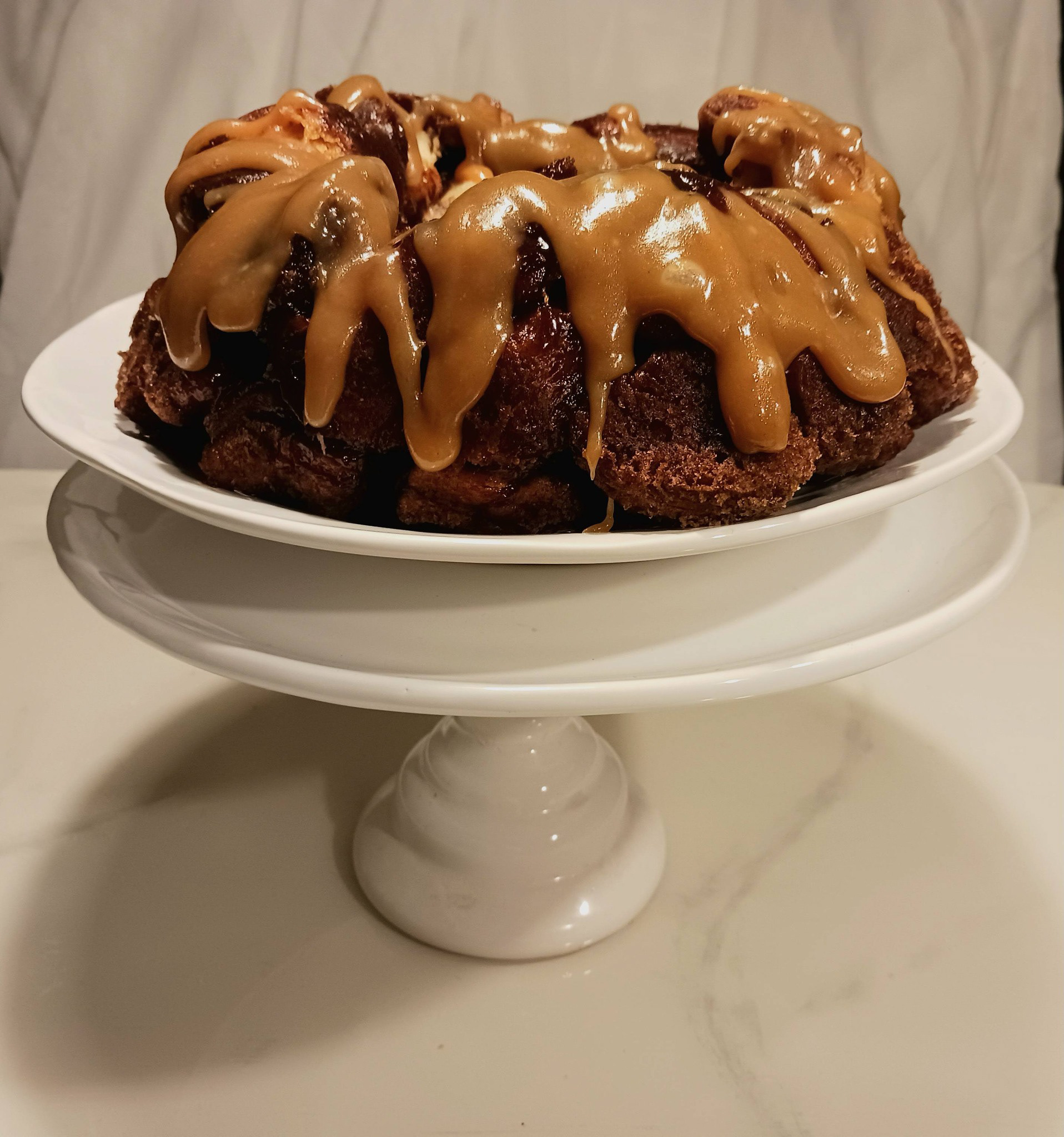 Homemade Caramel Rum Sauce dripped over homemade monkey bread. Can we say SUPER Mmm Mmm GOOD!! This will never disappoint.