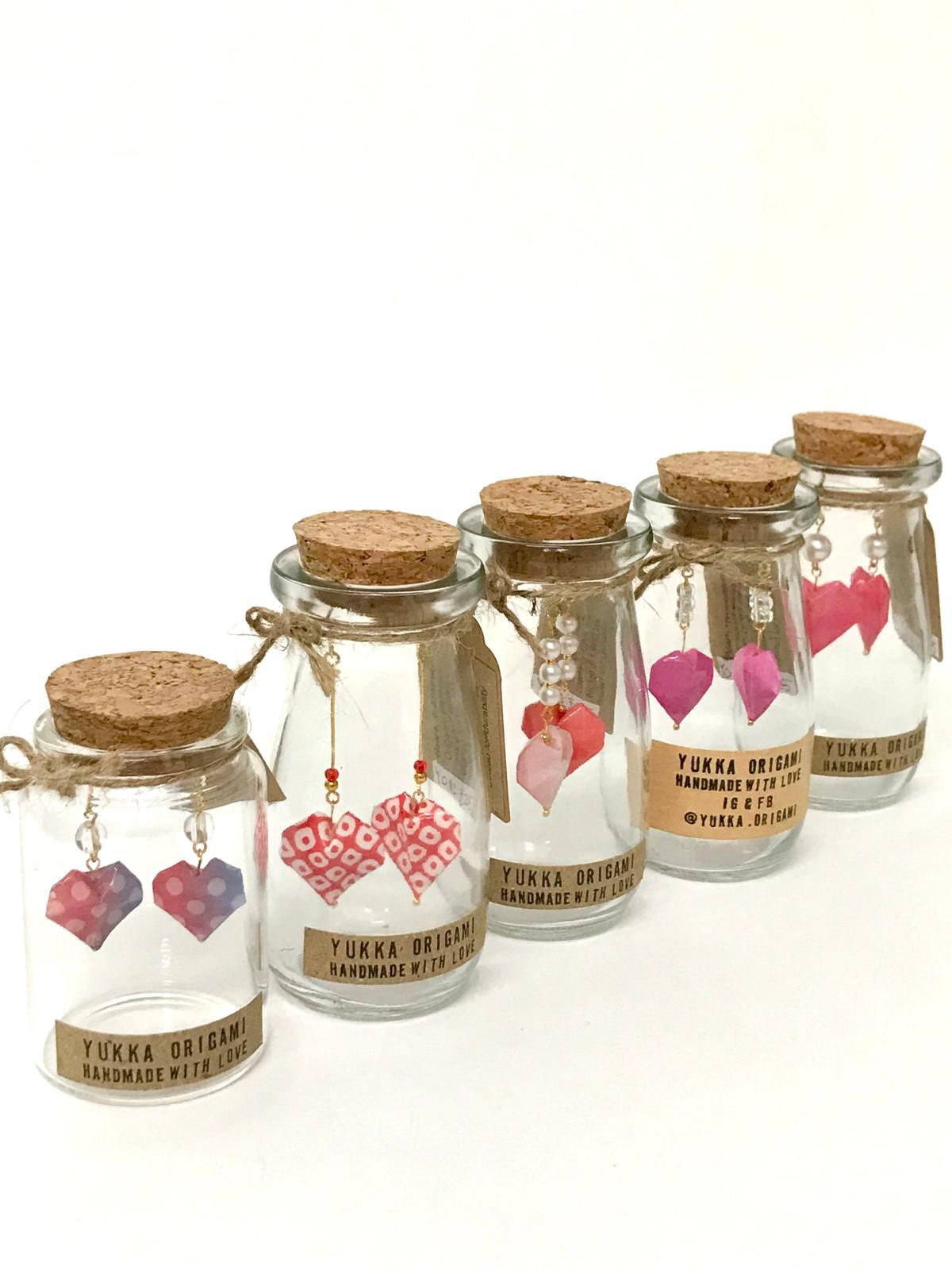 Origami Heart in a Glass Jar: £33, Made to order in a variety of colours. Because each item is handmade, slight variations in paper patterns and details may occur. Gold or silver findings available on request.