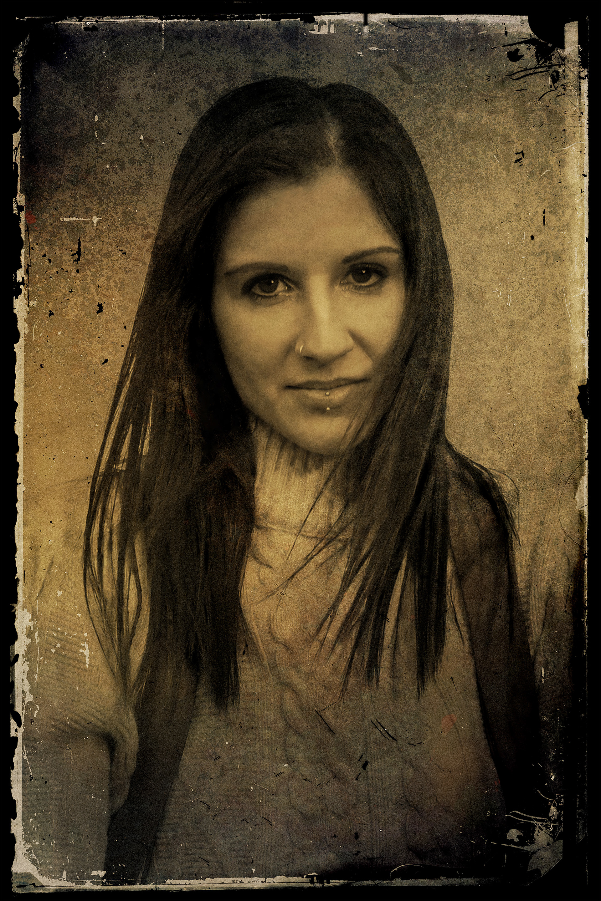 Vintage photograph of a young woman looking directly at the viewer with an enigmatic smile. 