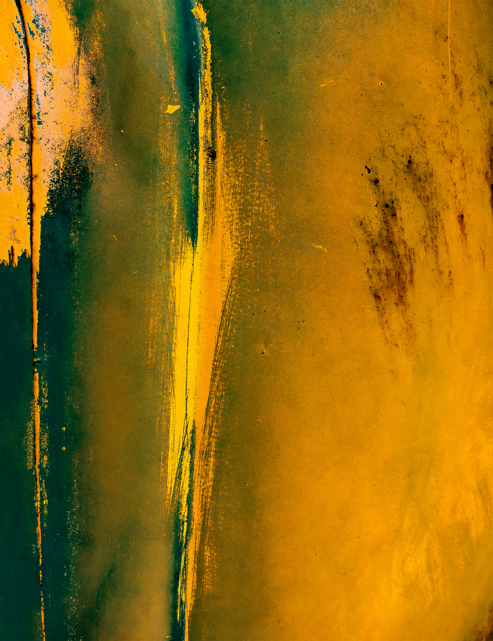Abstract Photograph of bright yellow, green and blue paint streaks on an antique truck hood