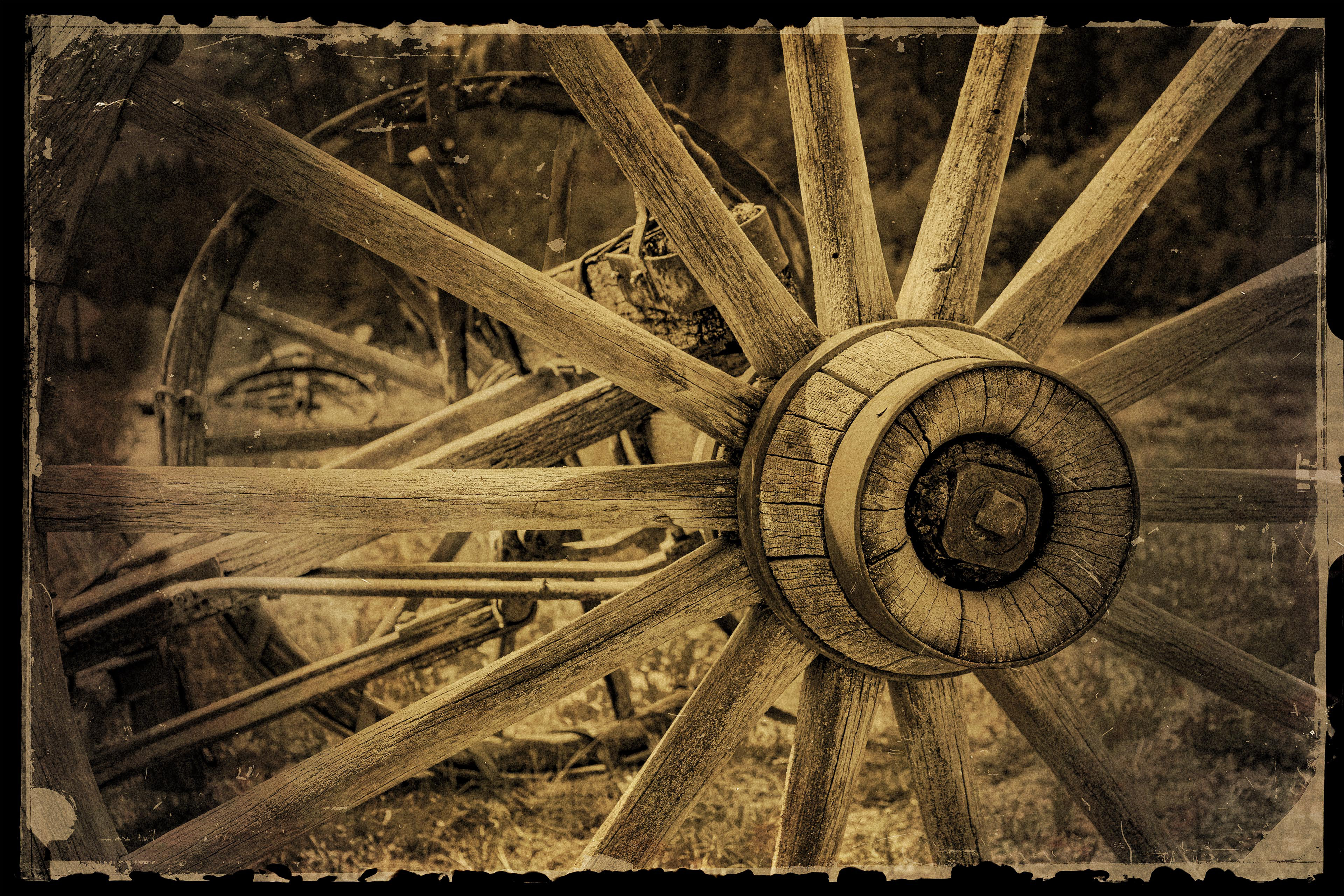Photograph of old, weathered wagon wheel image taken in Liberty Washington. 