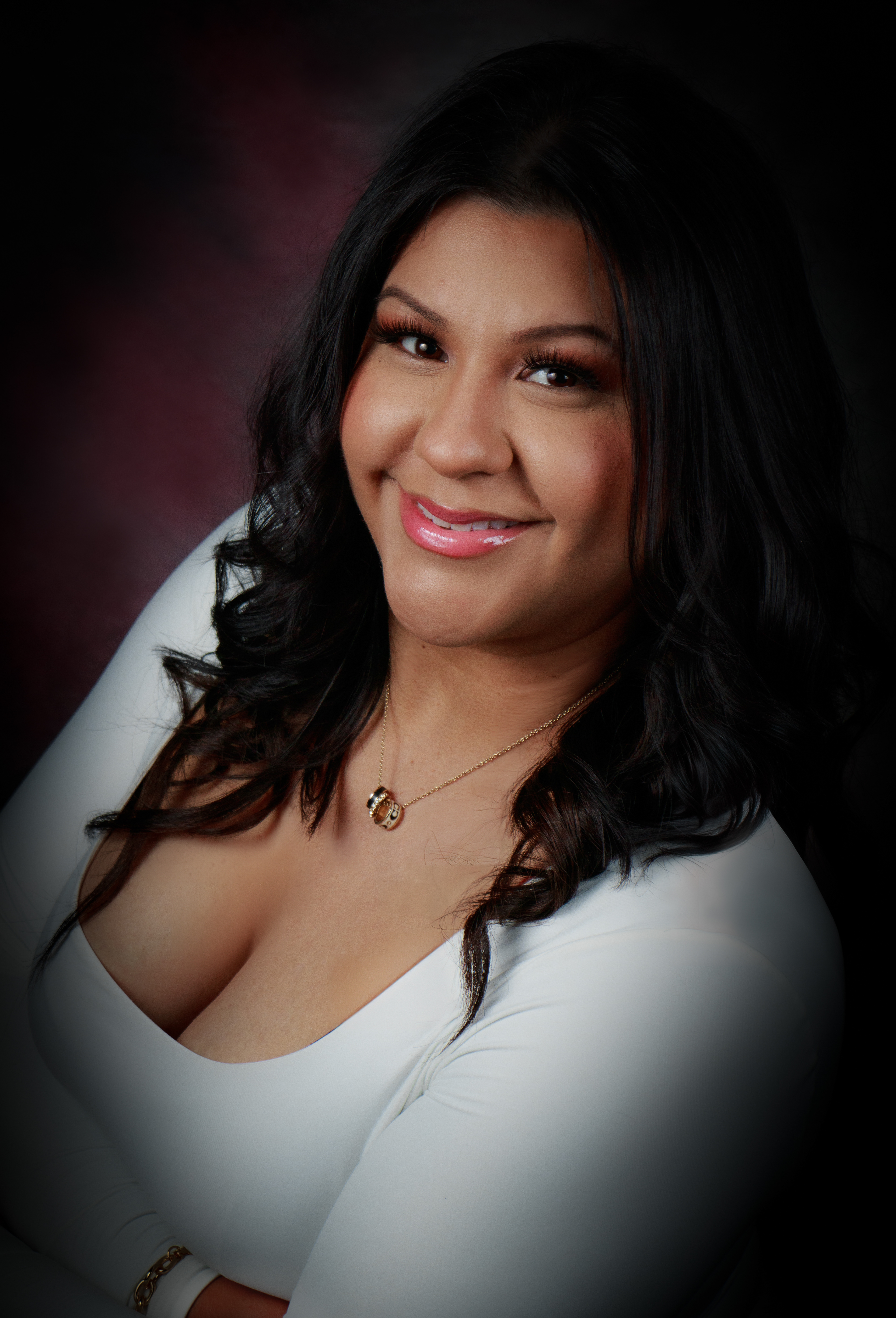 Headshot portrait of woman wearing white agent life insurance houston