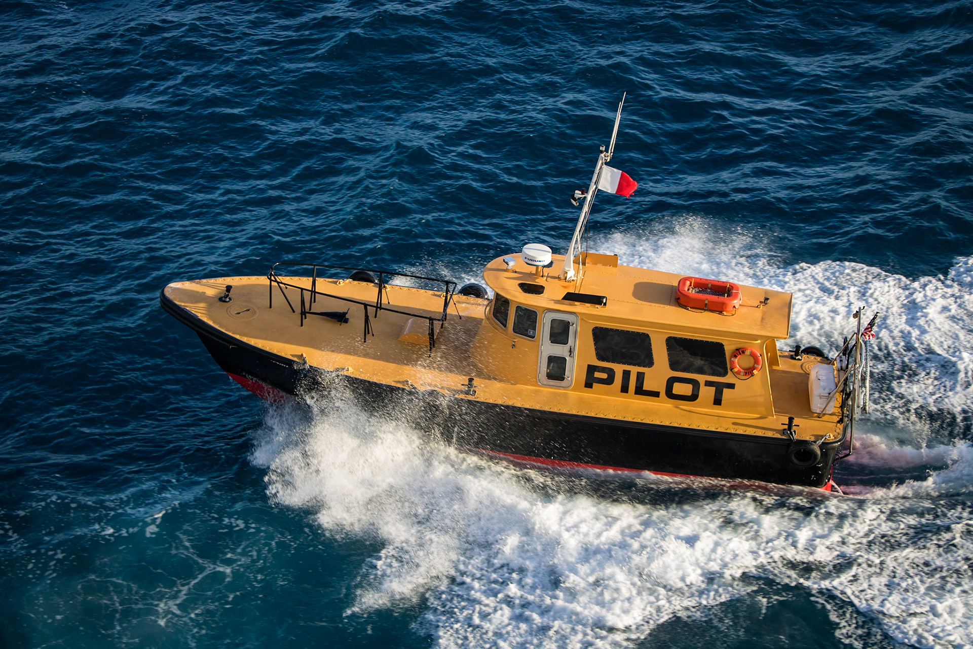 Biscayne Bay Pilot ship escorting the Disney Magic out of the Port of Miami.