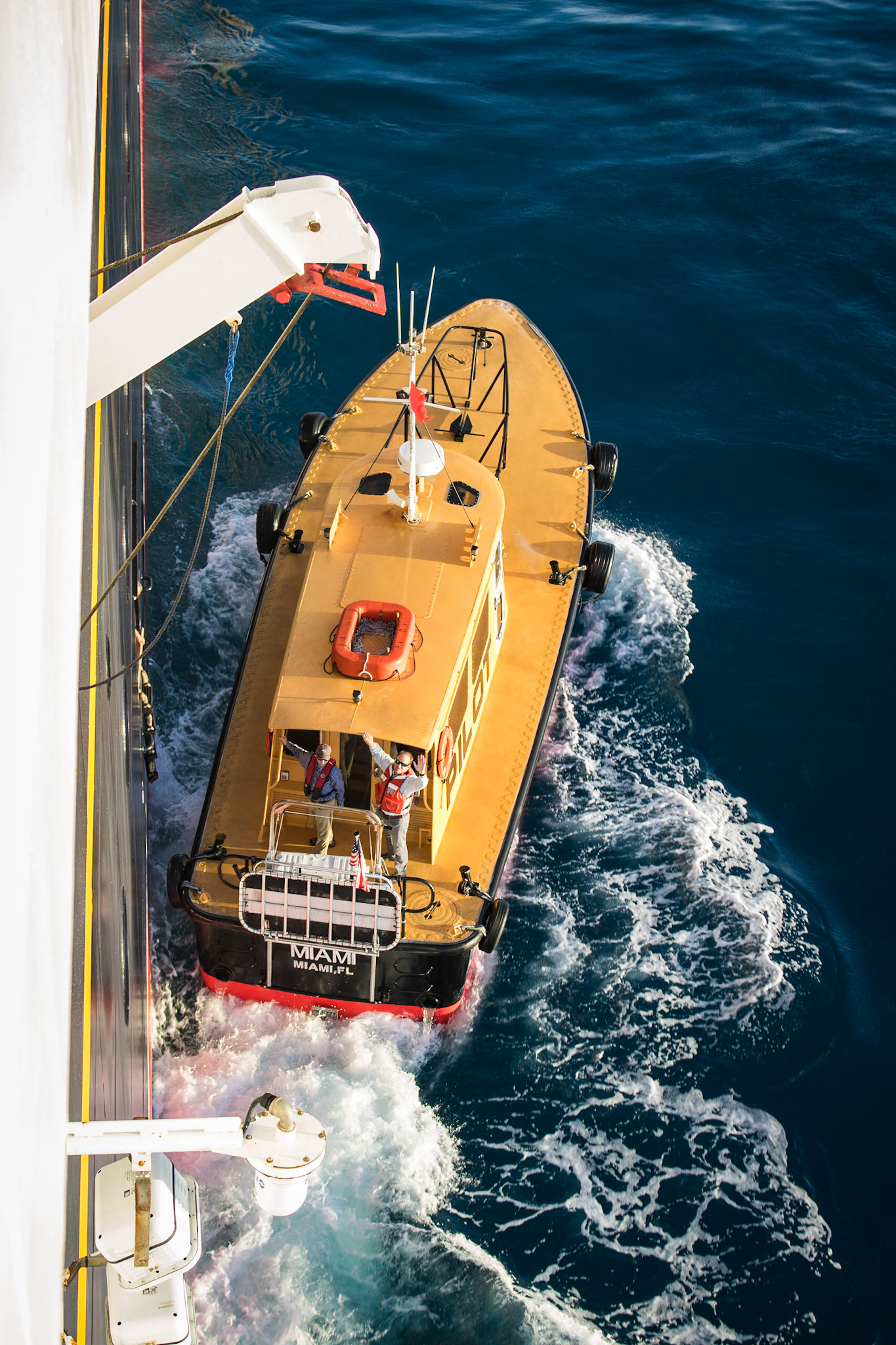 Biscayne Bay Pilot ship escorting the Disney Magic out of the Port of Miami.