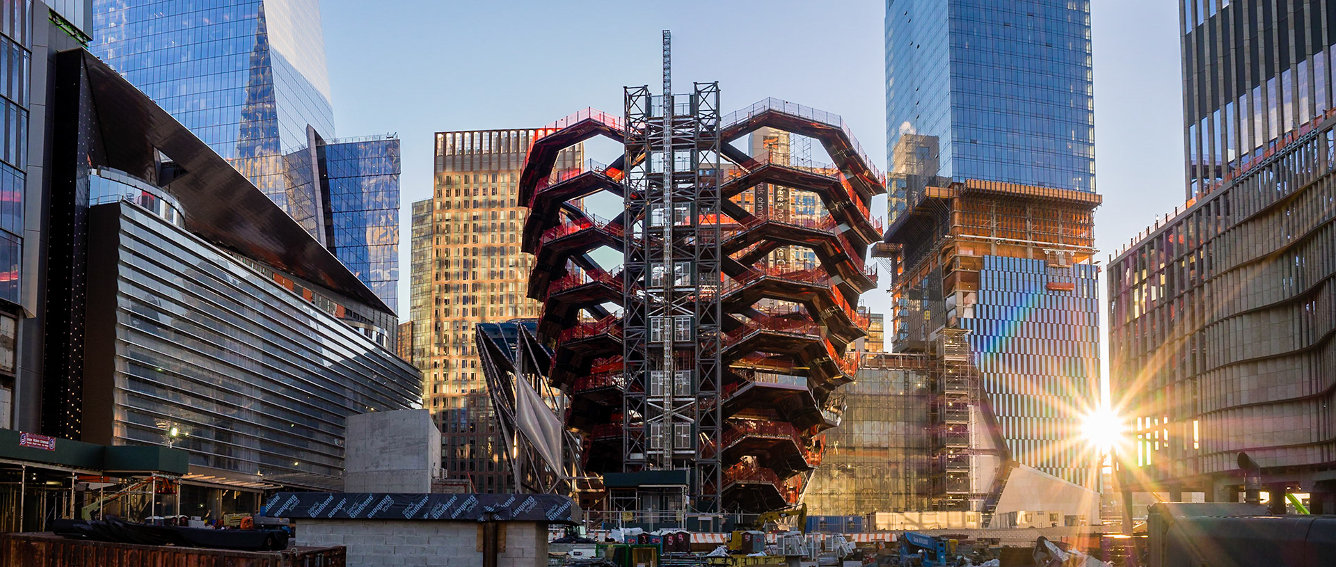 Panorama (with sun flare) of the construction at Manhattan's Hudson Yards, showing progress on the 15-story "Vessel."