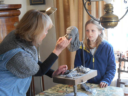 Portrait sculpture sitting