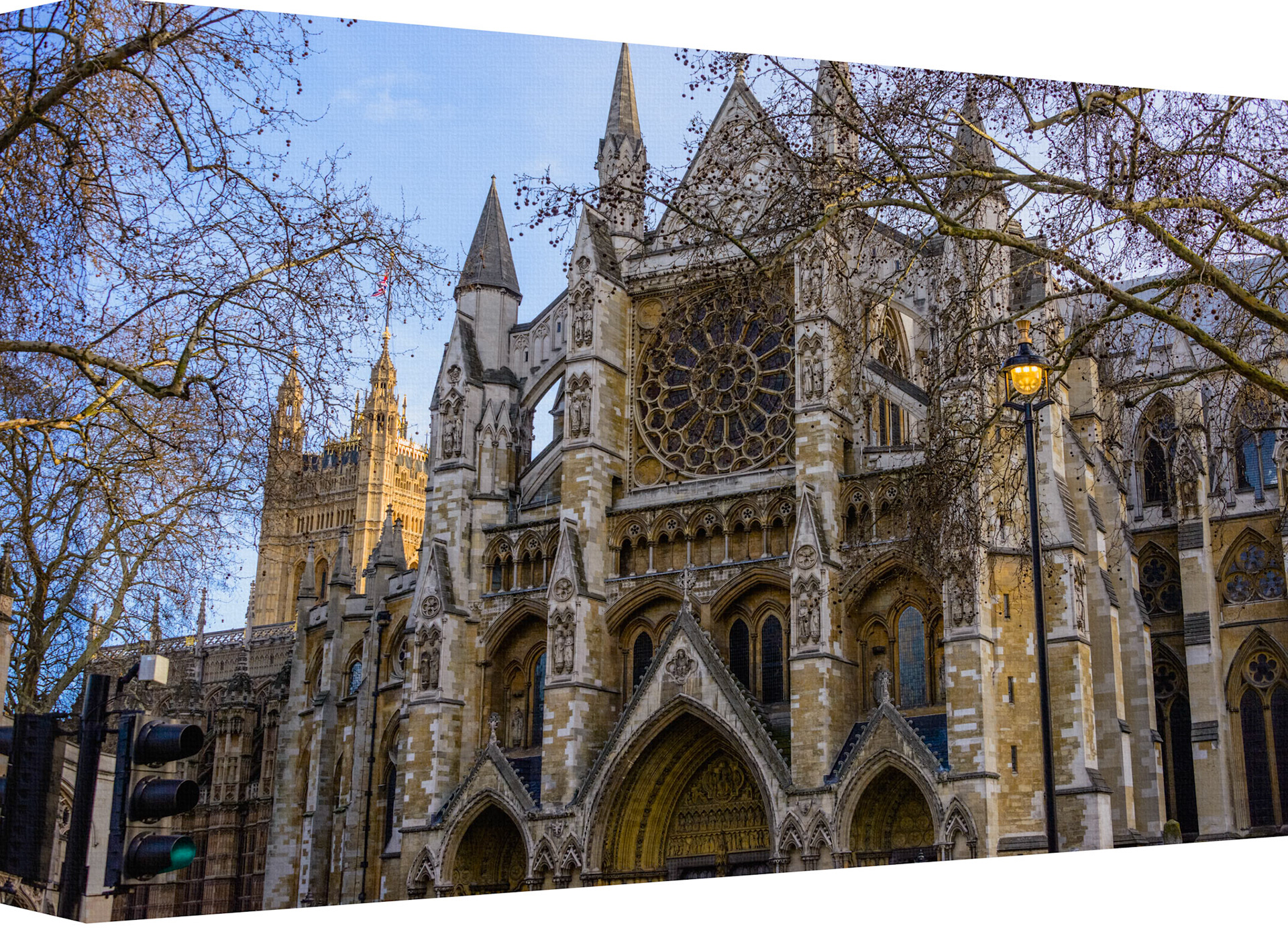 This captivating image showcases the intricate architecture of a Gothic-style church, a testament to medieval craftsmanship. The church stands majestically with its pointed arches, ribbed vaults, and flying buttresses. The facade is adorned with ornate carvings and statues that seem to tell stories of a bygone era. A large rose window serves as the centerpiece, with its delicate tracery and stained glass hinting at the play of light one would experience inside. The stonework exhibits a range of earthy tones, complemented by the verdant hues of trees partially obscuring the view, suggesting this church is not only a place of worship but also an integral part of its natural surroundings. This image captures both the historical significance and architectural beauty that make such buildings enduring symbols of cultural heritage.