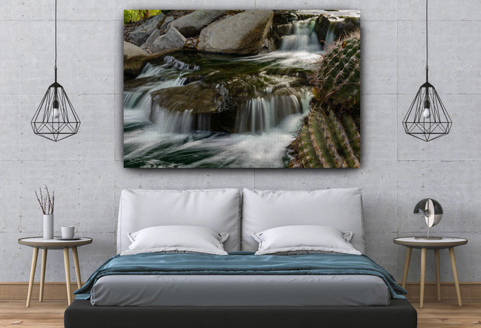 Canvas Artwork of Cactus Swirl is a stunning piece of wall art that captures the beauty of water flowing around a cactus plant. The Photo features a vibrant contrast of colors and textures, creating a dynamic and eye-catching effect. The cactus swirl motif is inspired by the natural patterns of succulents and their ability to store water in arid environments. This artwork is perfect for adding a touch of nature and elegance to any room. The Cactus Swirl canvas artwork depicts the beauty of water flowing around a cactus. The swirls create a dynamic contrast between the green and blue colors, and the cactus adds a touch of nature to the scene.
