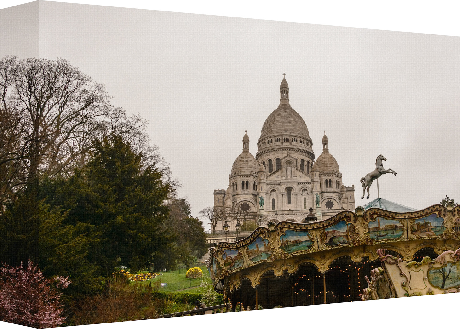 This photo wall artwork captures the stunning view of the Sacred Heart of Paris, a Roman Catholic church and minor basilica, situated at the top of the Montmartre hill, the highest point in the city of Paris. The artwork also features the charming carousel in the foreground, adding a touch of whimsy and nostalgia to the scene. Photo was taken on cold and rainy cloud covered day. This artwork is perfect for anyone who loves the beauty and history of Paris, or who wants to bring some of its magic into their home.
