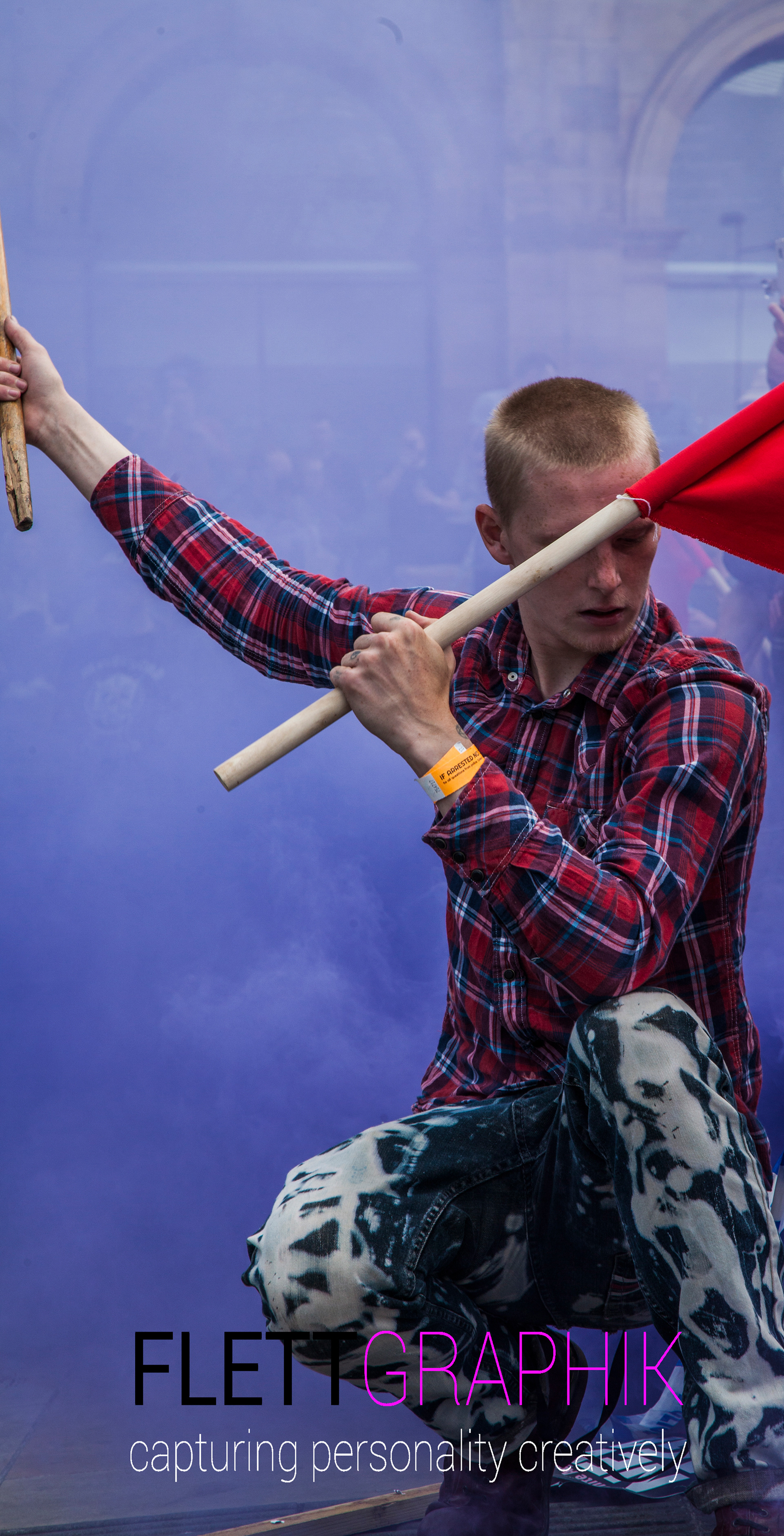 Antifascist in purple smoke with flags Liverpool