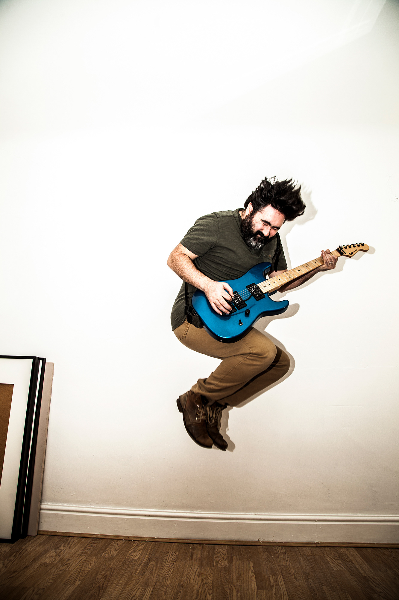 Self Portrait jumping with a guitar