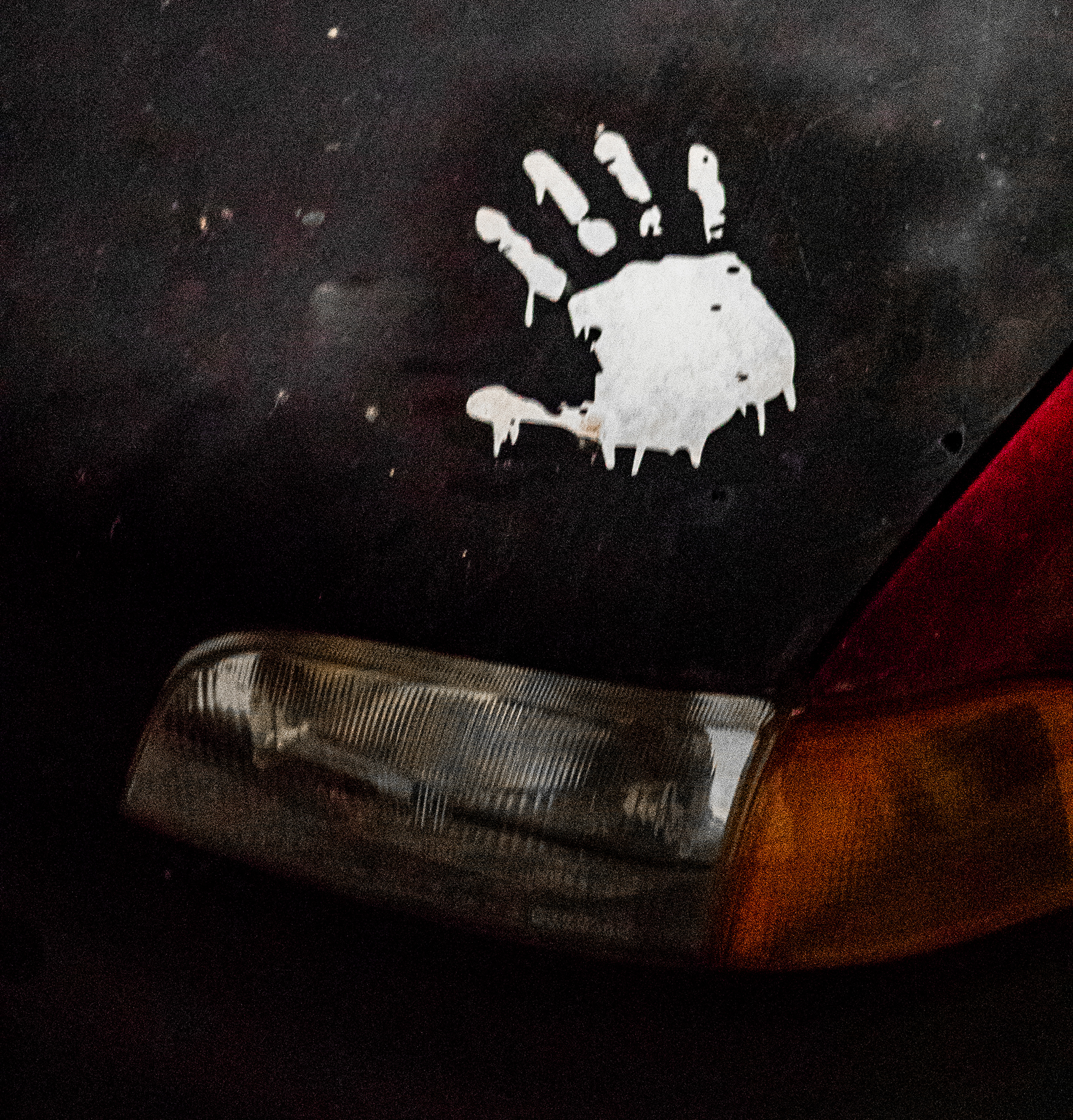White hand painted onto black car
