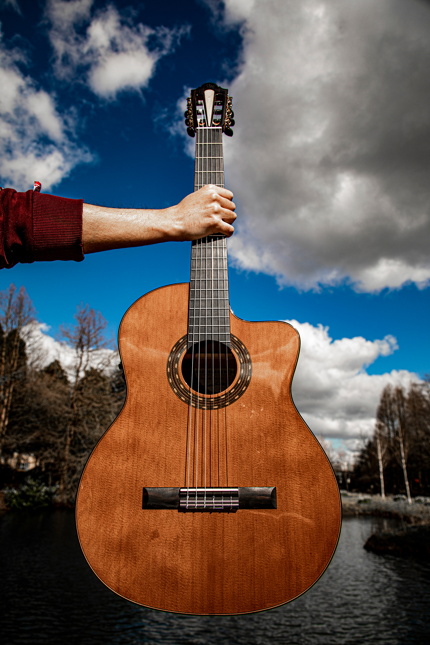 Merida Classical Acoustic held aloft