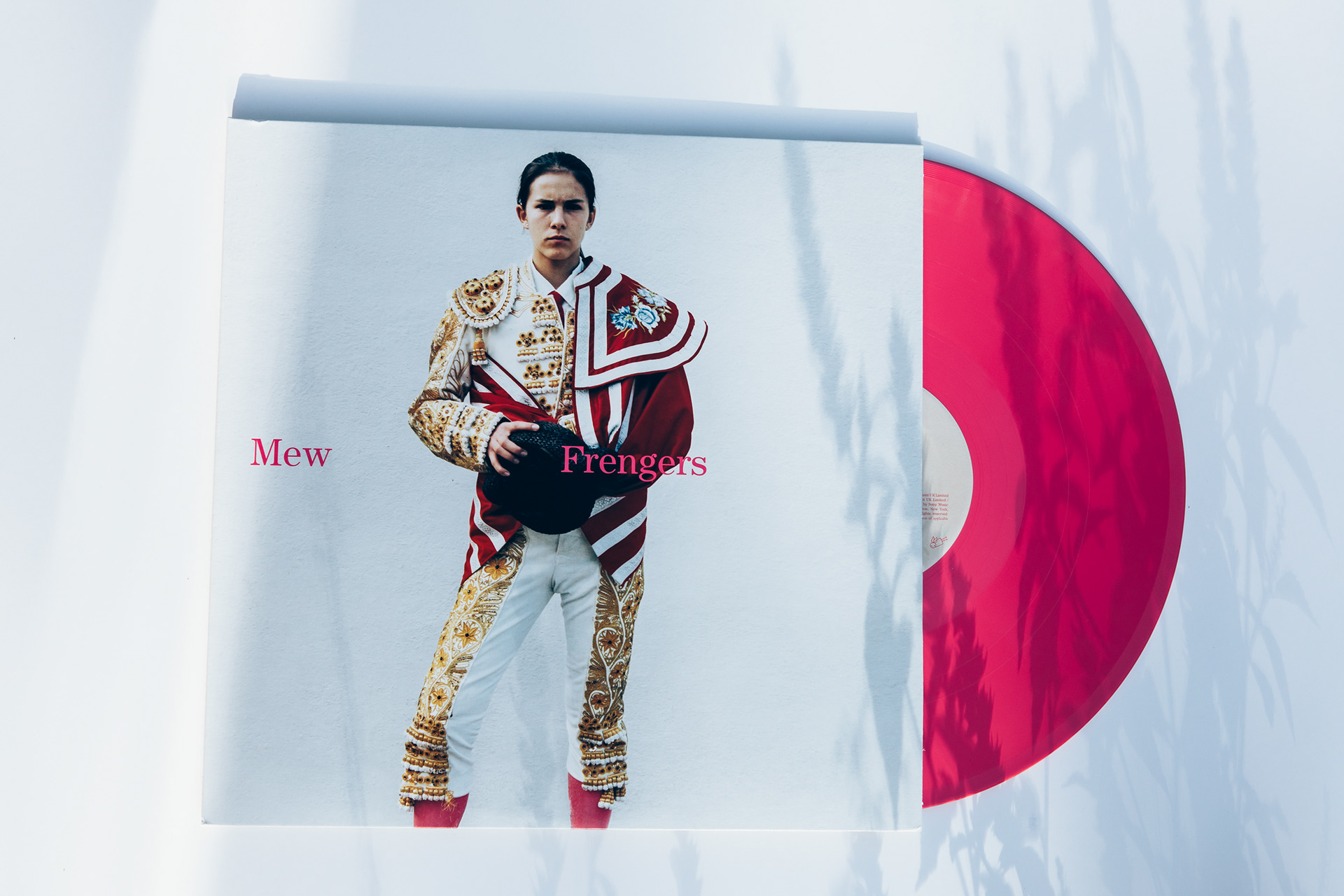 person holding a record sleeve in front of their face, vinyl record photography by Chris Stokes