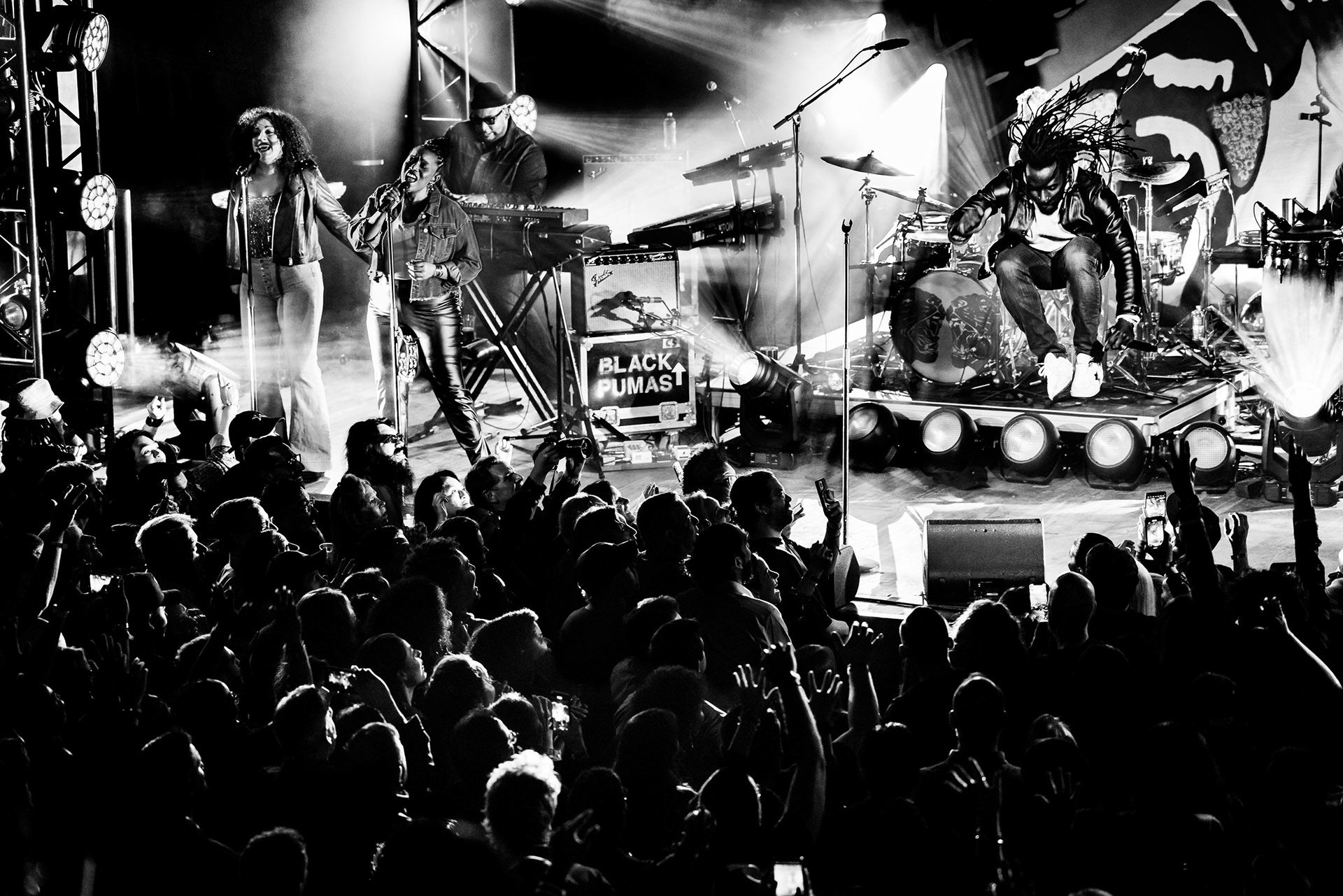 live band on stage with the audience silhouetted in the foreground, San Antonio concert photographer Chris Stokes