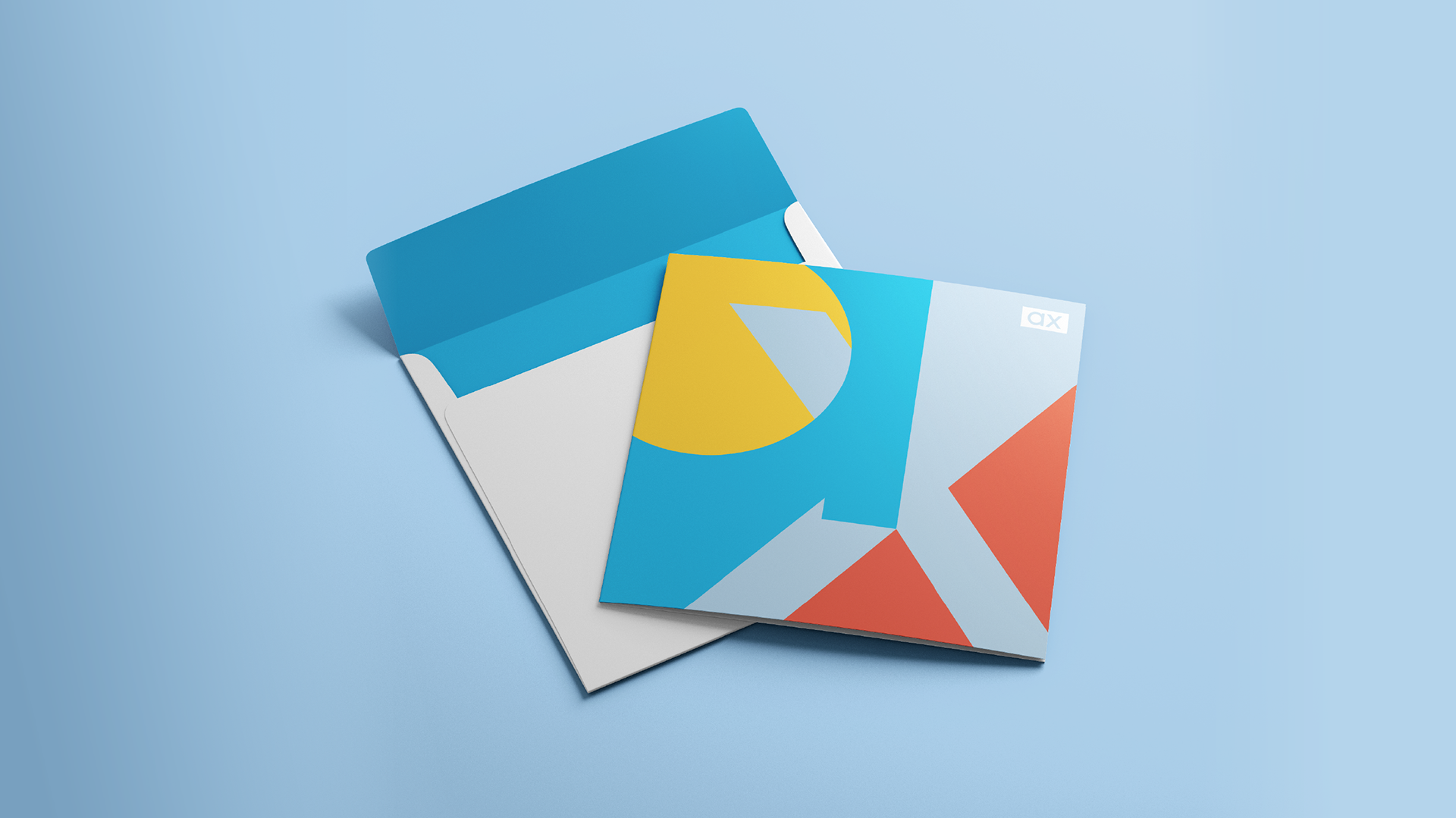 A photo of a square card and envelope with an abstract lettering combination of the logo icon (designs by Kat Vochoska).